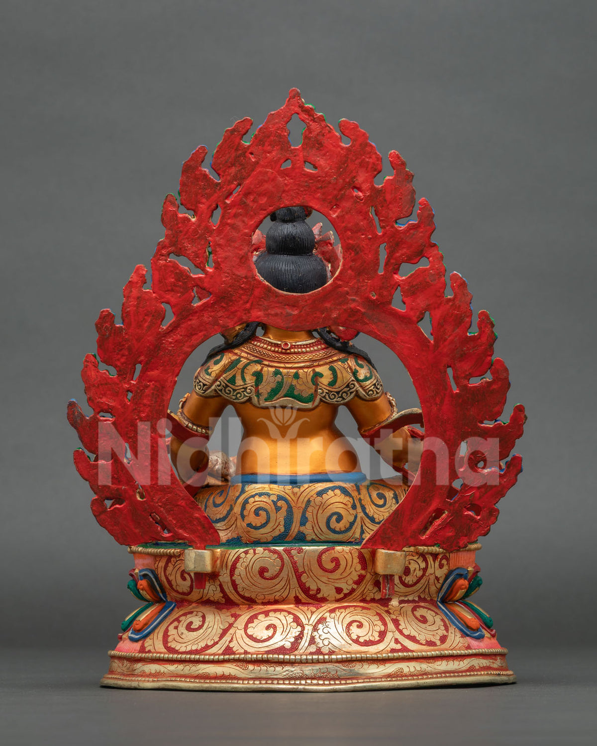 Dzambhala statue Buddhist wealth deity copper sculpture back view.