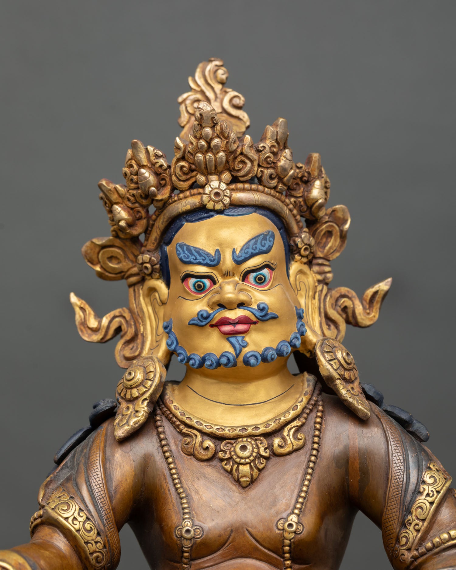 Dzambhala statue close-up, Buddhist wealth god art from Patan, Nepal