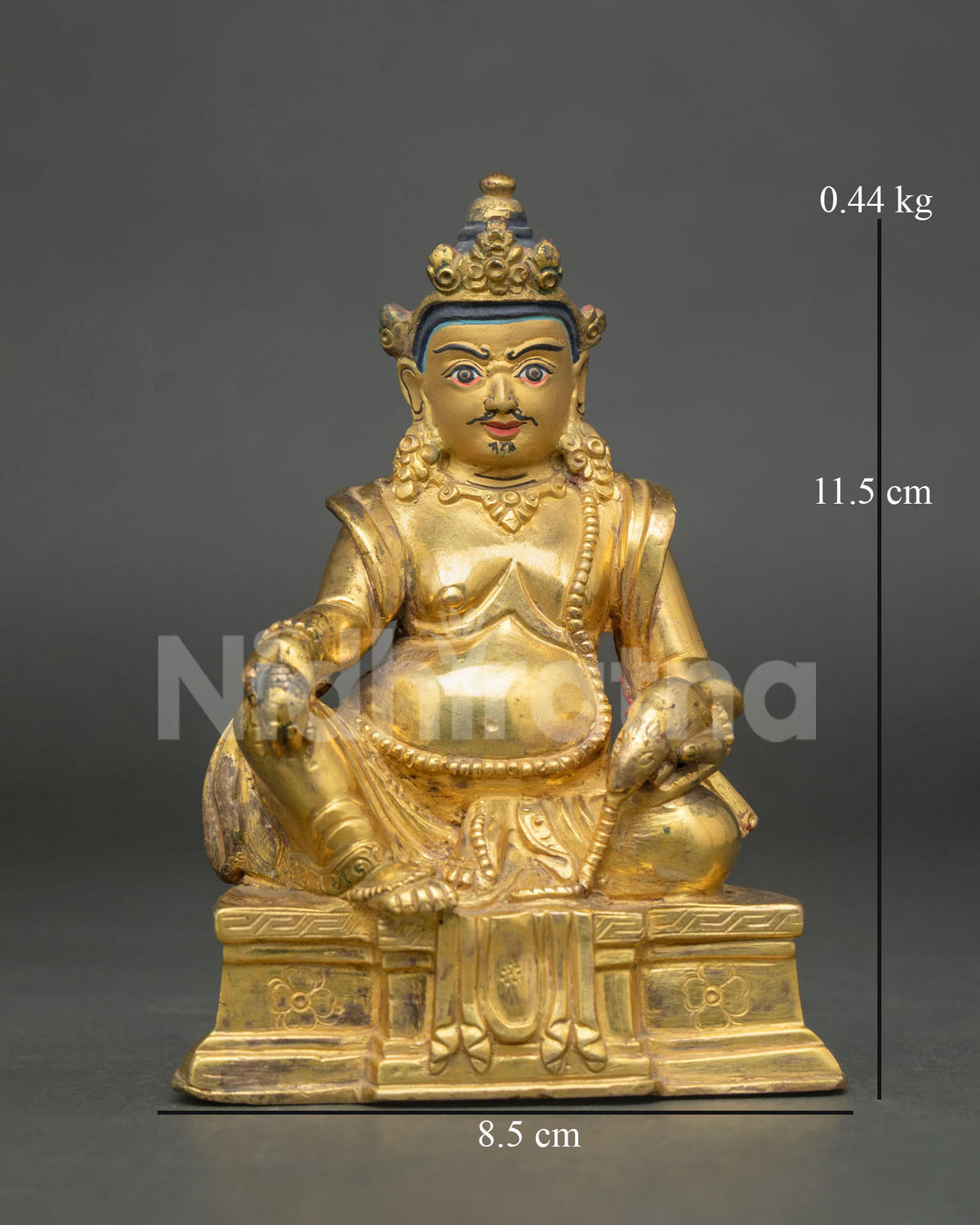 Dzambhala statue gold fire gilded copper Newari artisan Patan Nepal front view.
