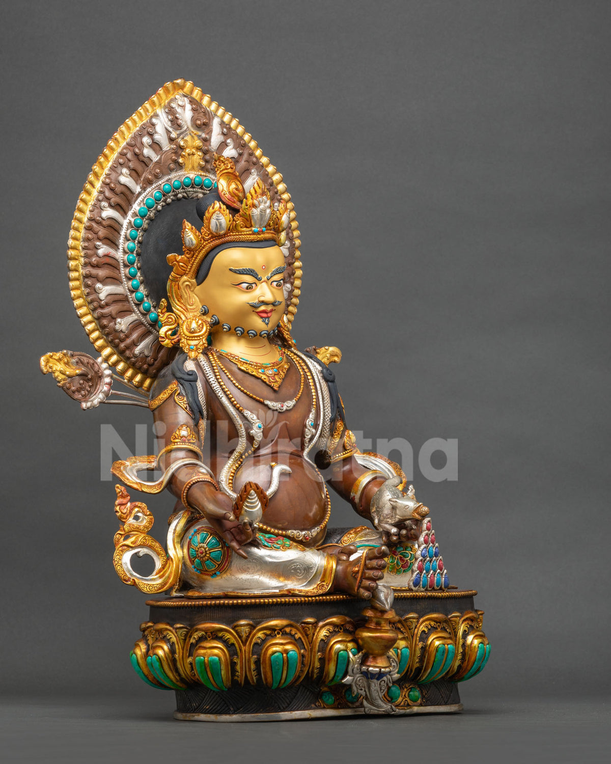 Dzambhala Statue right side view seated with extended leg, mongoose and gold-gilded halo