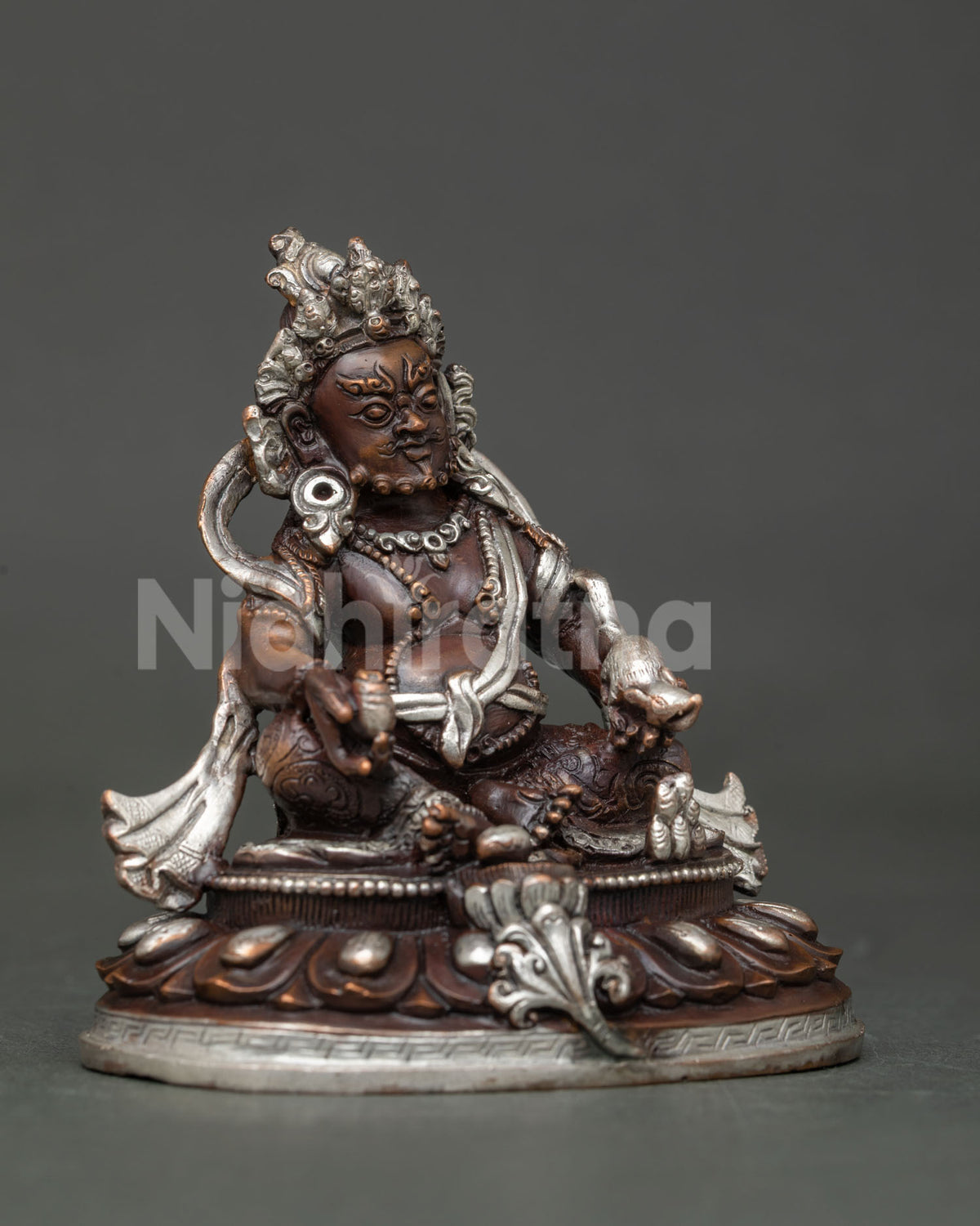Dzambhala statue seated on hand carved lotus pedestal with citron fruit.