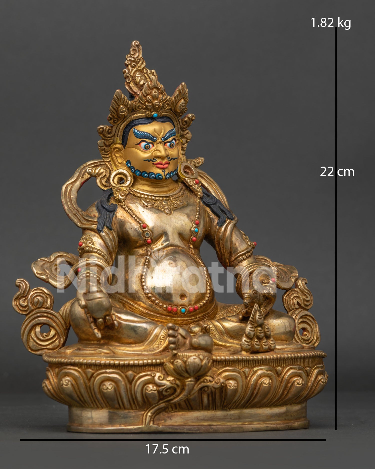 Dzambhala statue with mongoose citron fruit and semi precious stones.