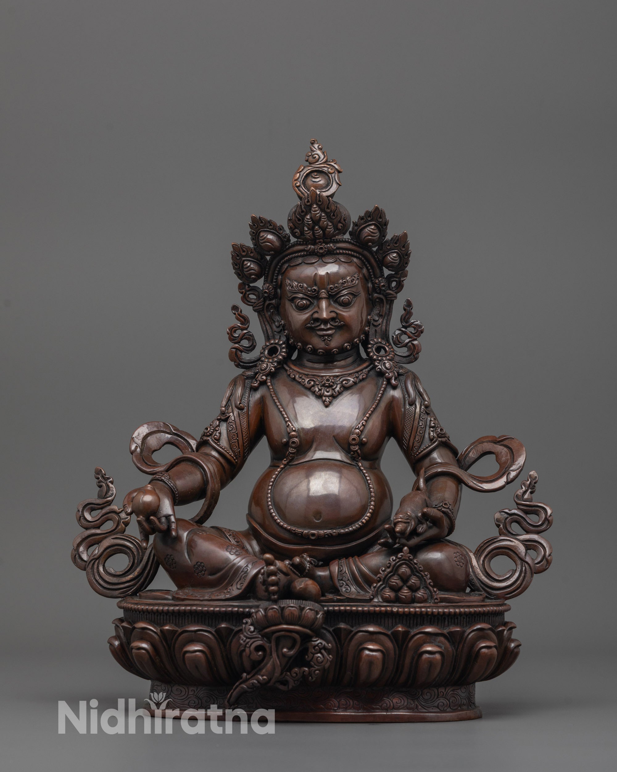 dzambhala statue front view showing oxidized copper finish and hand-carved citron fruit details