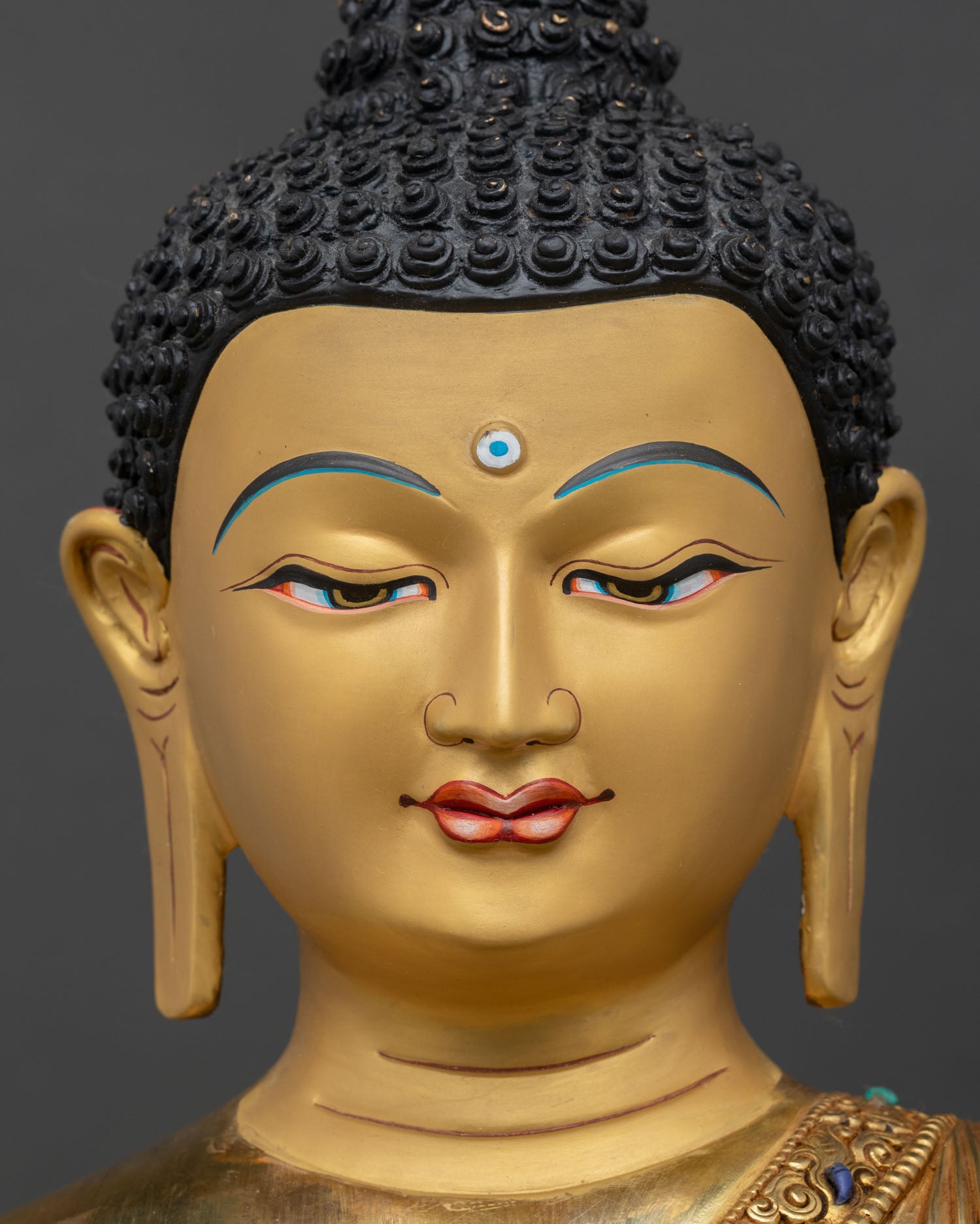 face close up shakyamuni buddha, serene gold painted expression buddhist art