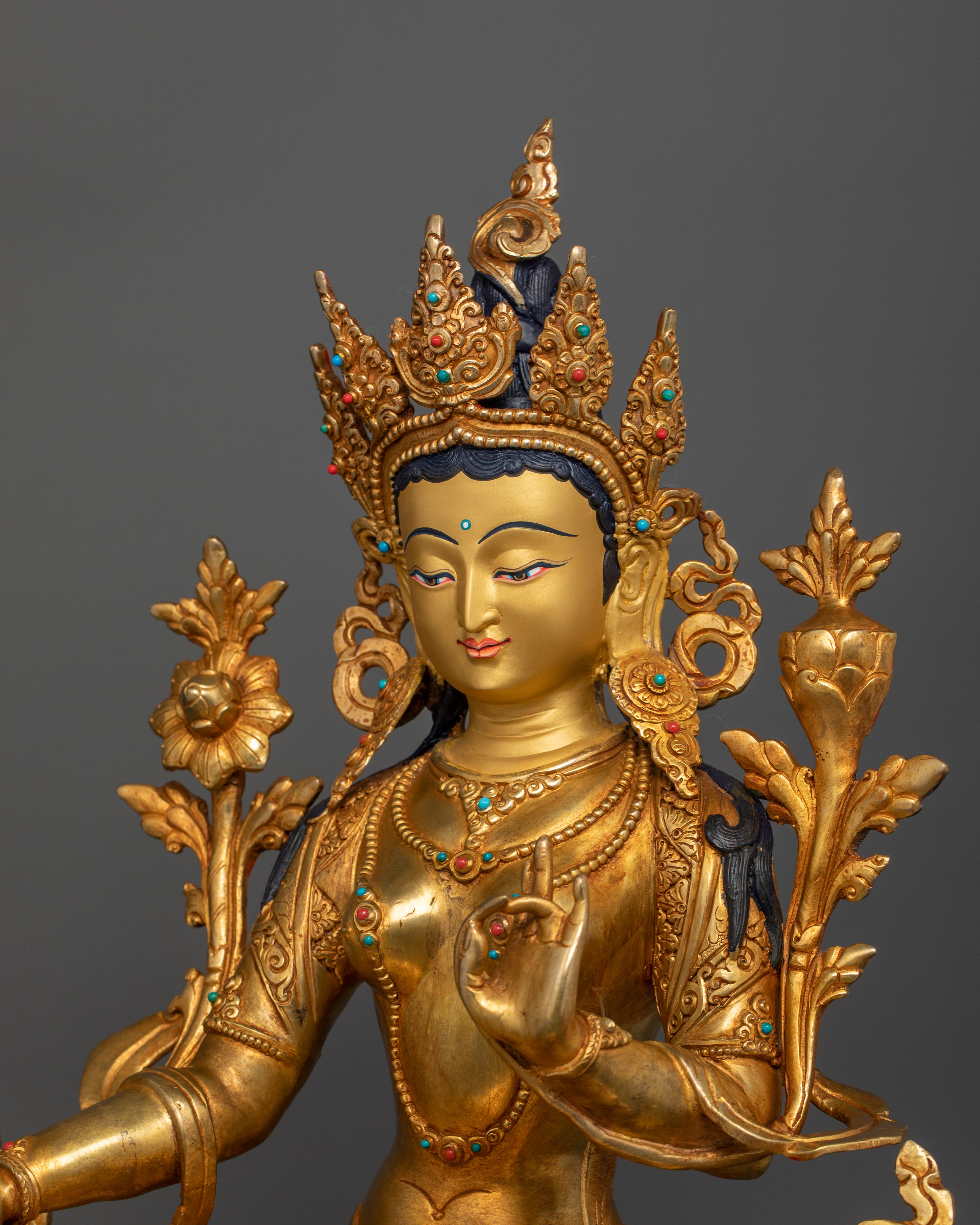 side profile of green tara gold plated statue