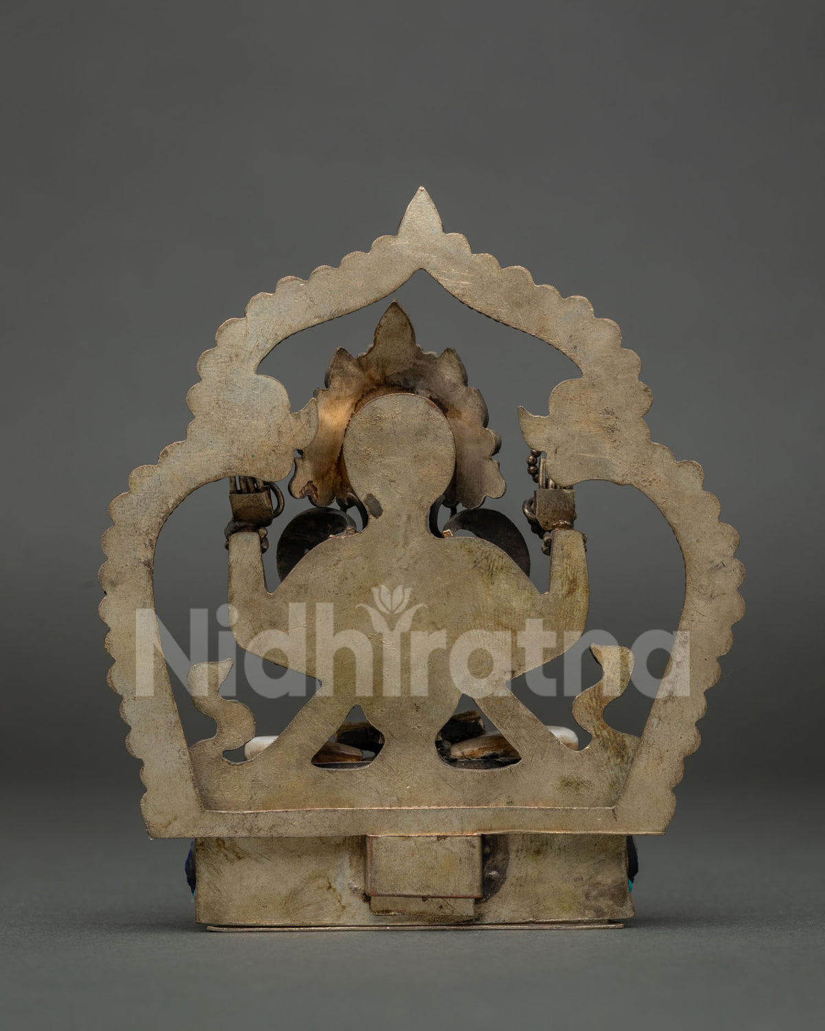 Four-arm Avalokiteshvara statue with crystal rosary, lotus and filigree detailing, copper and stone