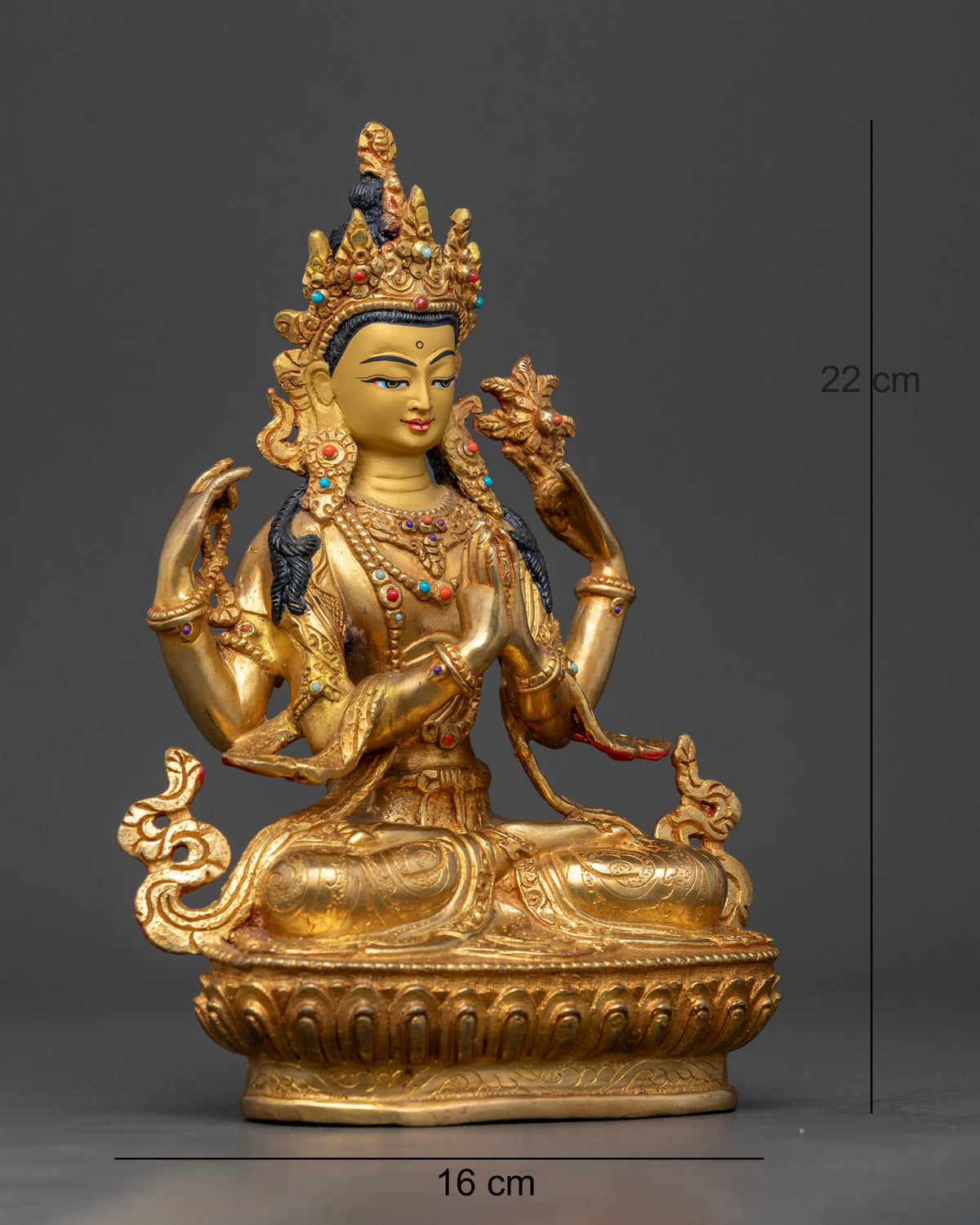 Four-armed Avalokiteshvara seated on a lotus pedestal symbolizing compassion and loving-kindness