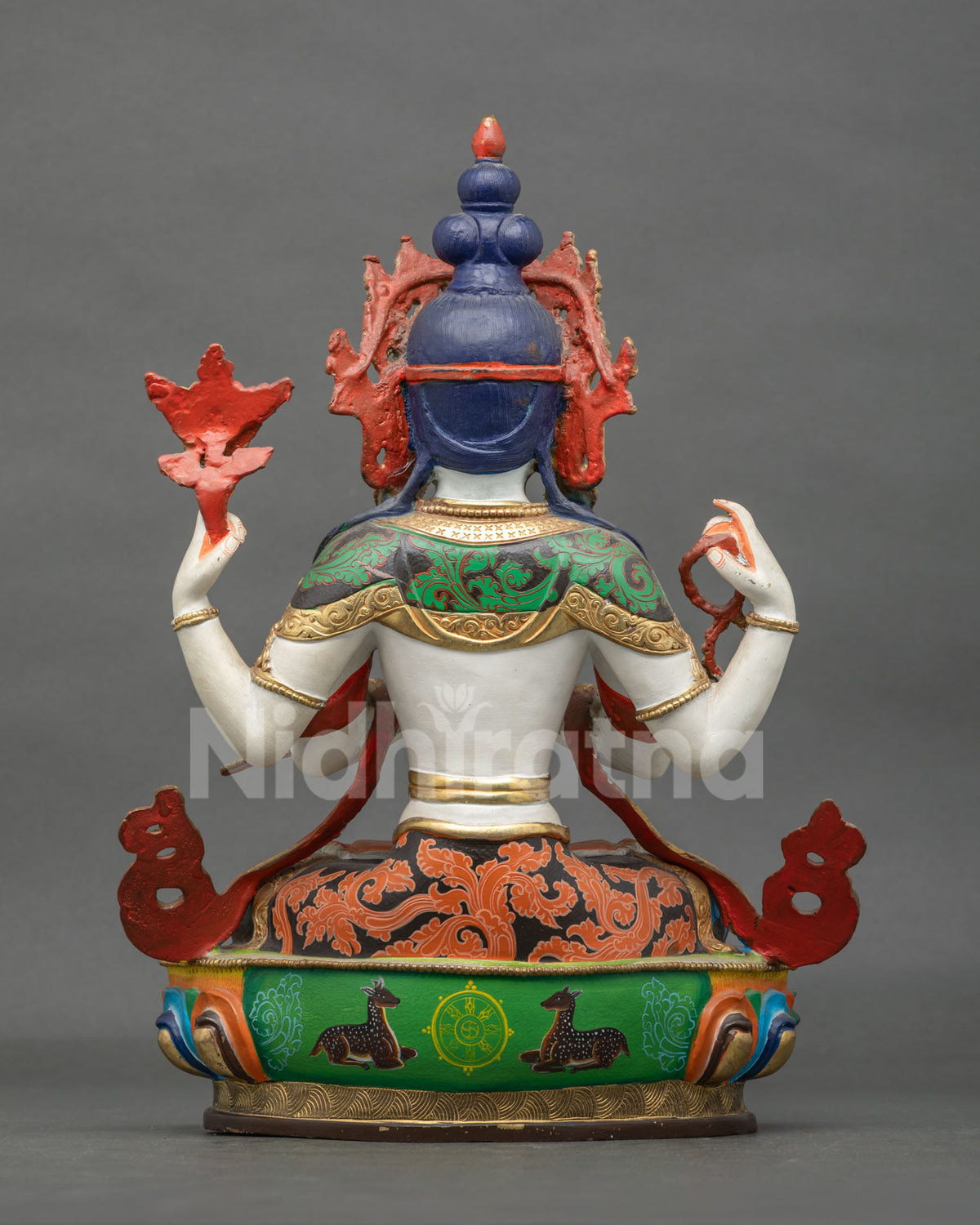 Four-armed Chenrezig statue with a hand-carved lotus pedestal, crafted from copper by a Newari artisan from Patan, Nepal.