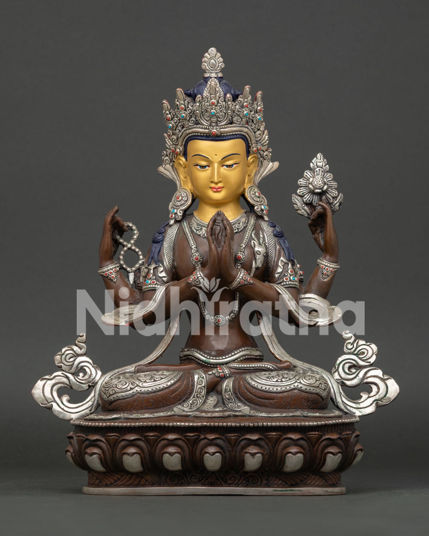 Four-Armed Chenrezig statue holding crystal rosary and lotus, Anjali Mudra with wish-fulfilling jewel.