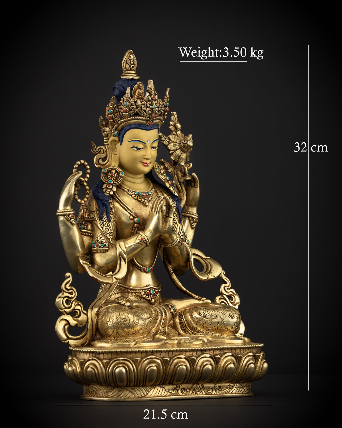 Four-armed Chenrezig statue seated on a lotus pedestal, holding a wish-fulfilling jewel, crystal rosary, lotus, and sacred scripture.