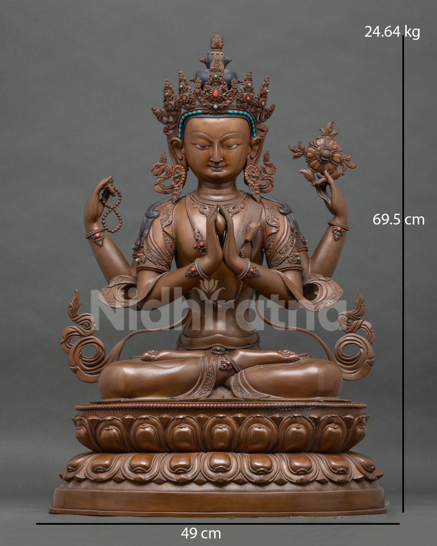 Four-armed copper Chenrezig statue in anjali mudra, holding rosary and lotus, front view