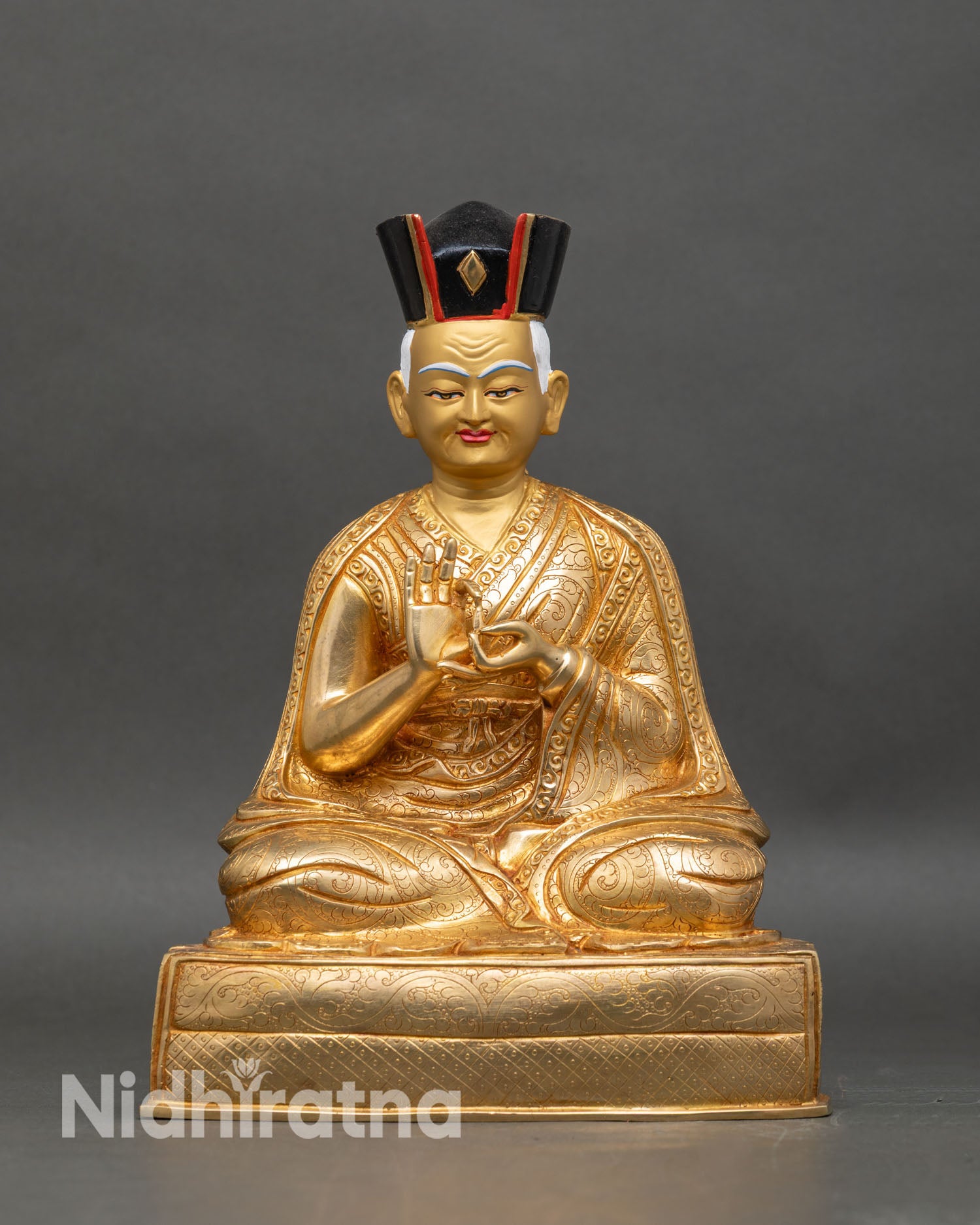 Front view of 1st Karmapa Dusum Khyenpa statue with Black Crown and gold gilding