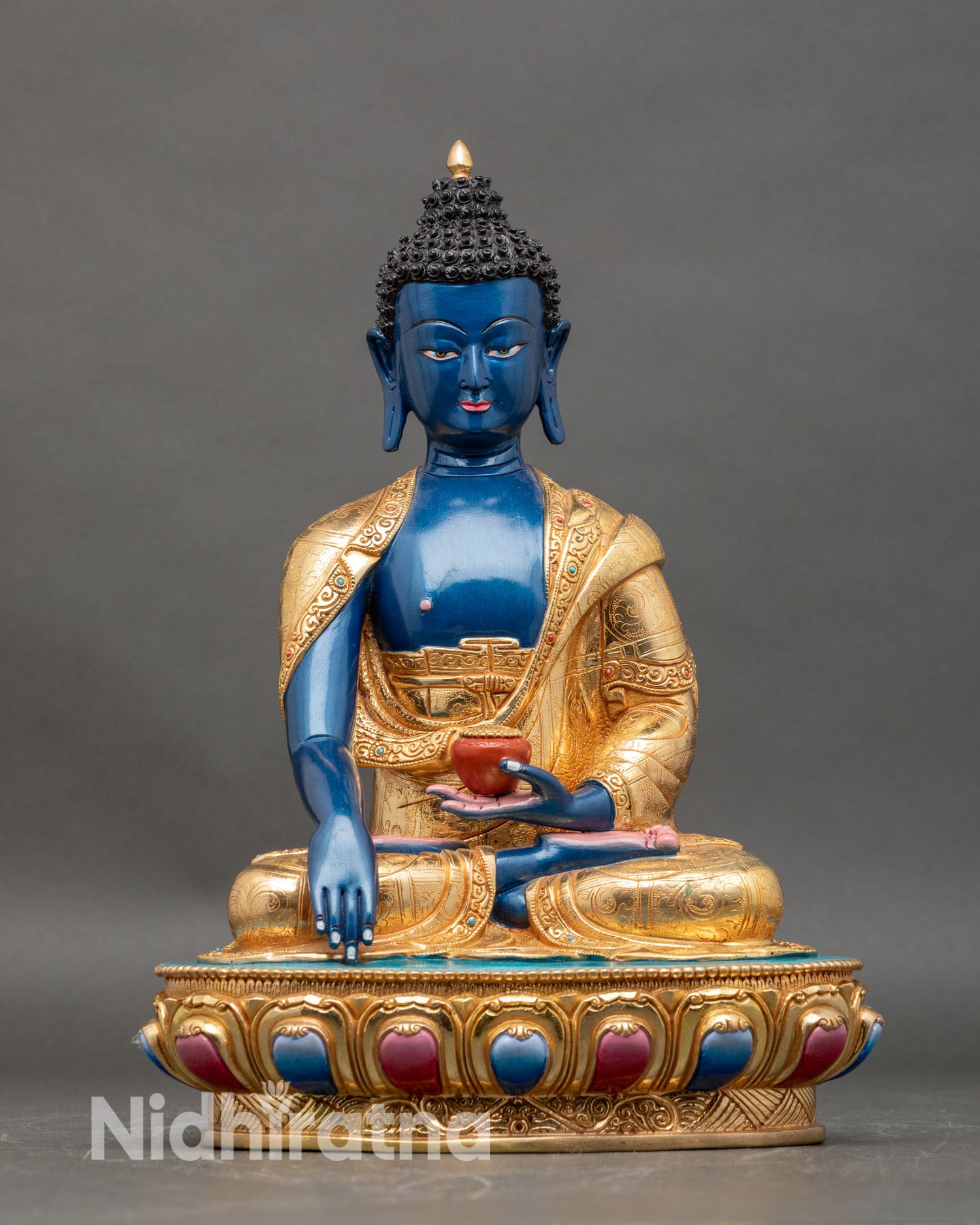 front view of Deep Blue Shakyamuni Buddha statue handcrafted gold detailing semi precious stones lotus base