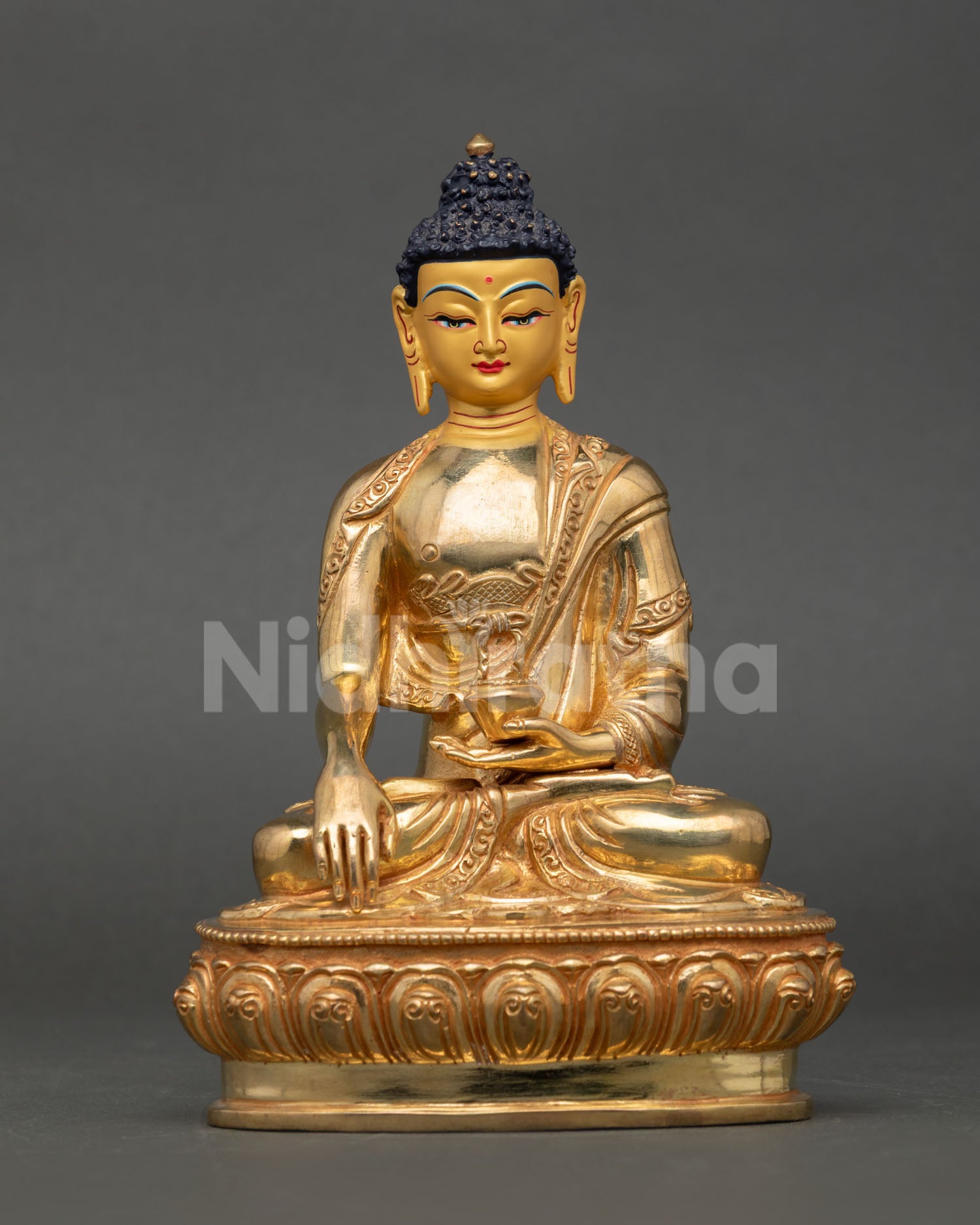Front view of Buddha Shakyamuni Statue handcrafted in copper with gold gilded finish from Nepal for meditation and spiritual decor