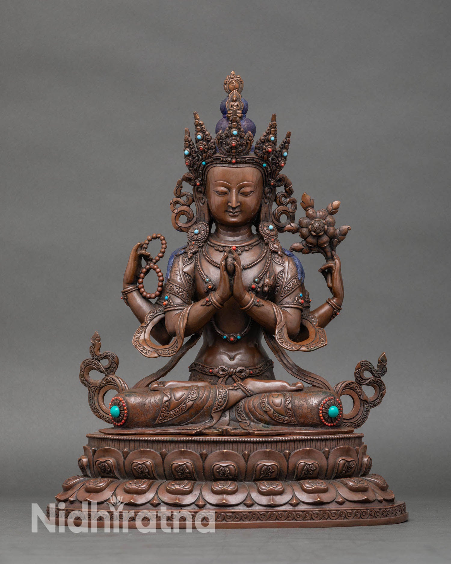 Front view of Chenrezig oxidized copper statue with semi precious stones from Nepal