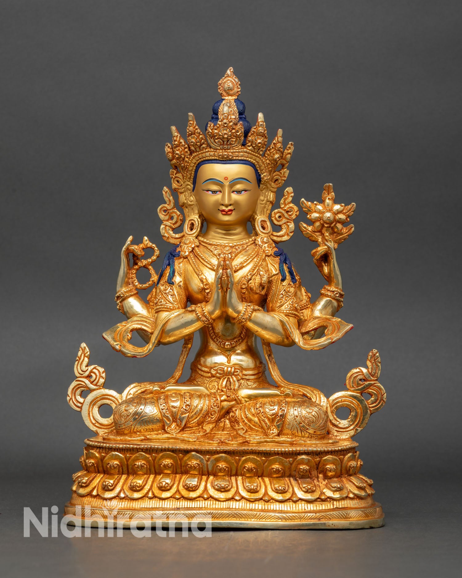 Front view of Chenrezig statue, gold accents copper Nepalese spiritual art