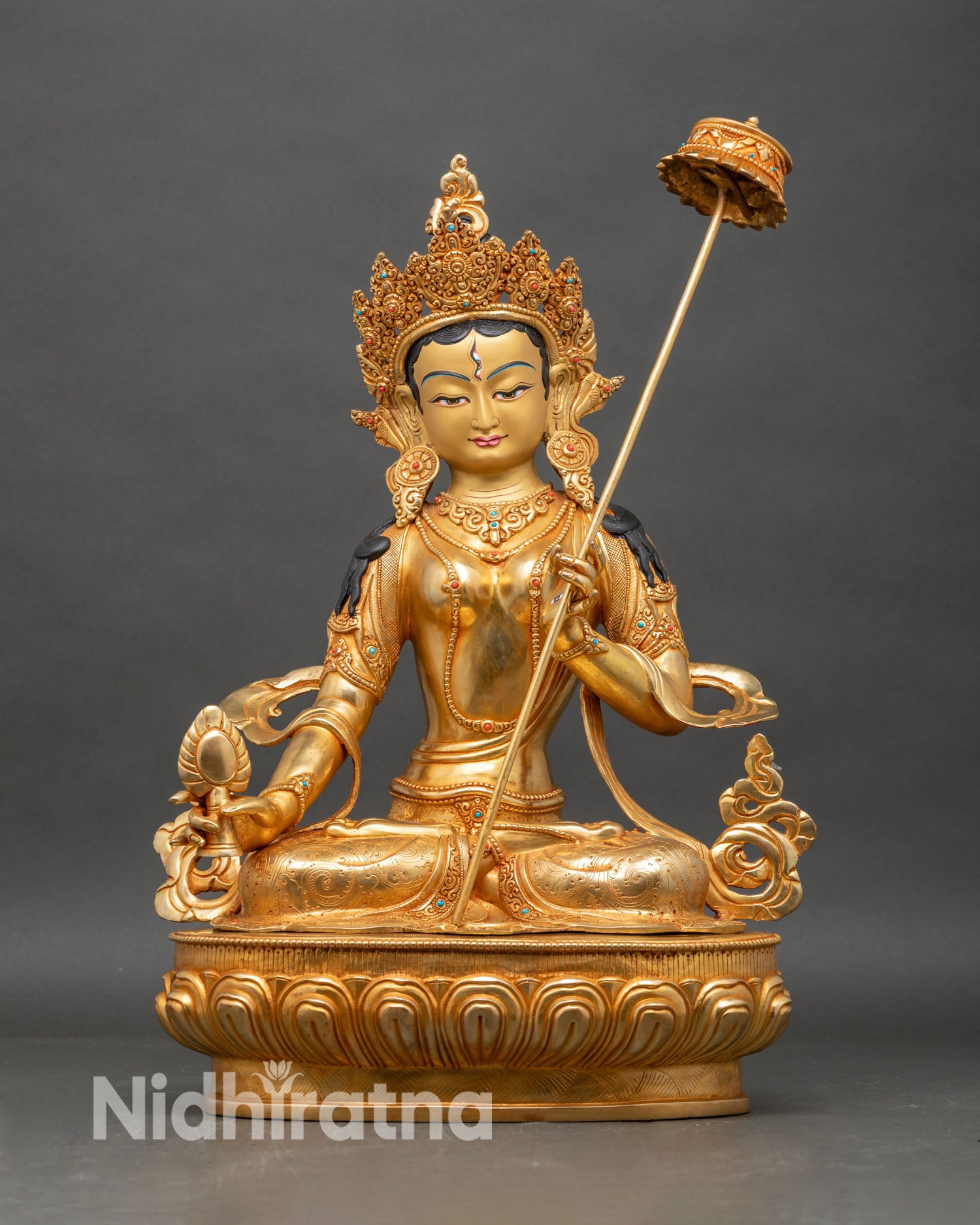 Front view of Dukar statue, handcrafted Nepalese copper with gold fire-gilded details