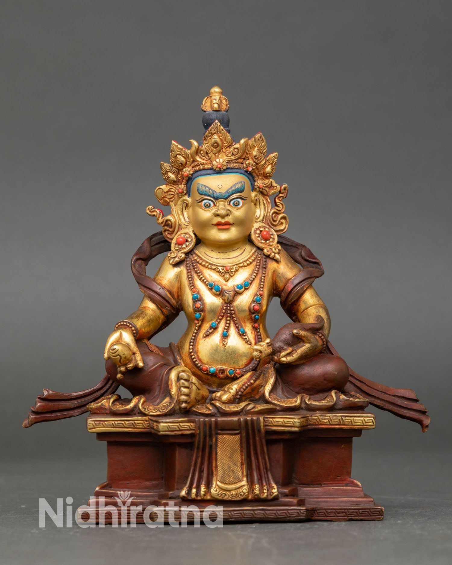 Front view of Dzambhala statue, Buddhist wealth deity, handmade copper sculpture from Nepal gold gilded oxidized finish, semi precious stones lost wax casting