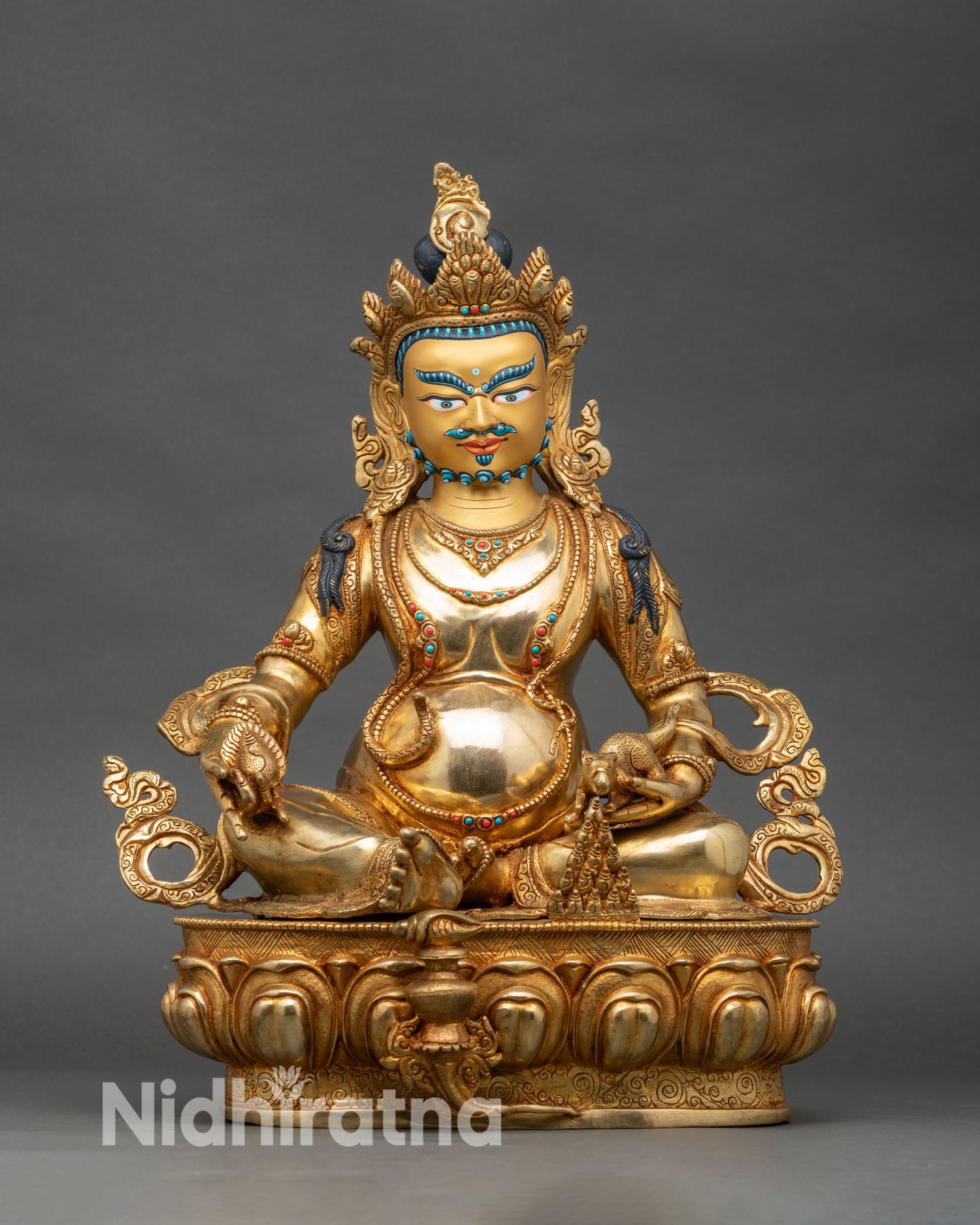 Front view Dzambhala statue, copper and gold fire-gilded Nepalese wealth deity