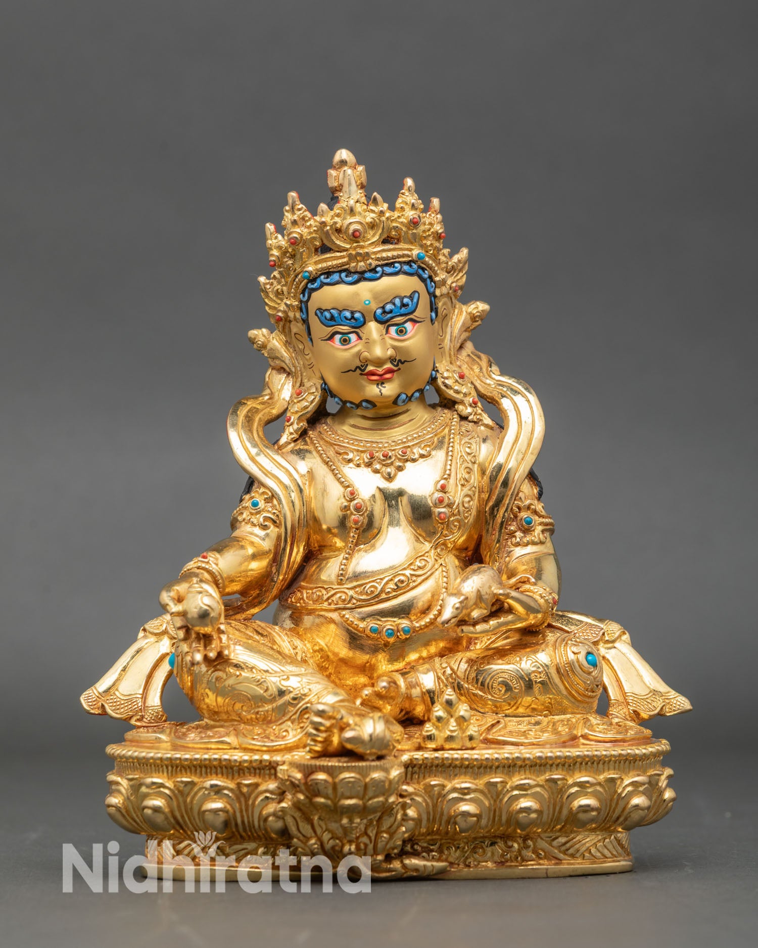 Front view Dzambhala statue gold gilded copper lotus pedestal Patan Nepal