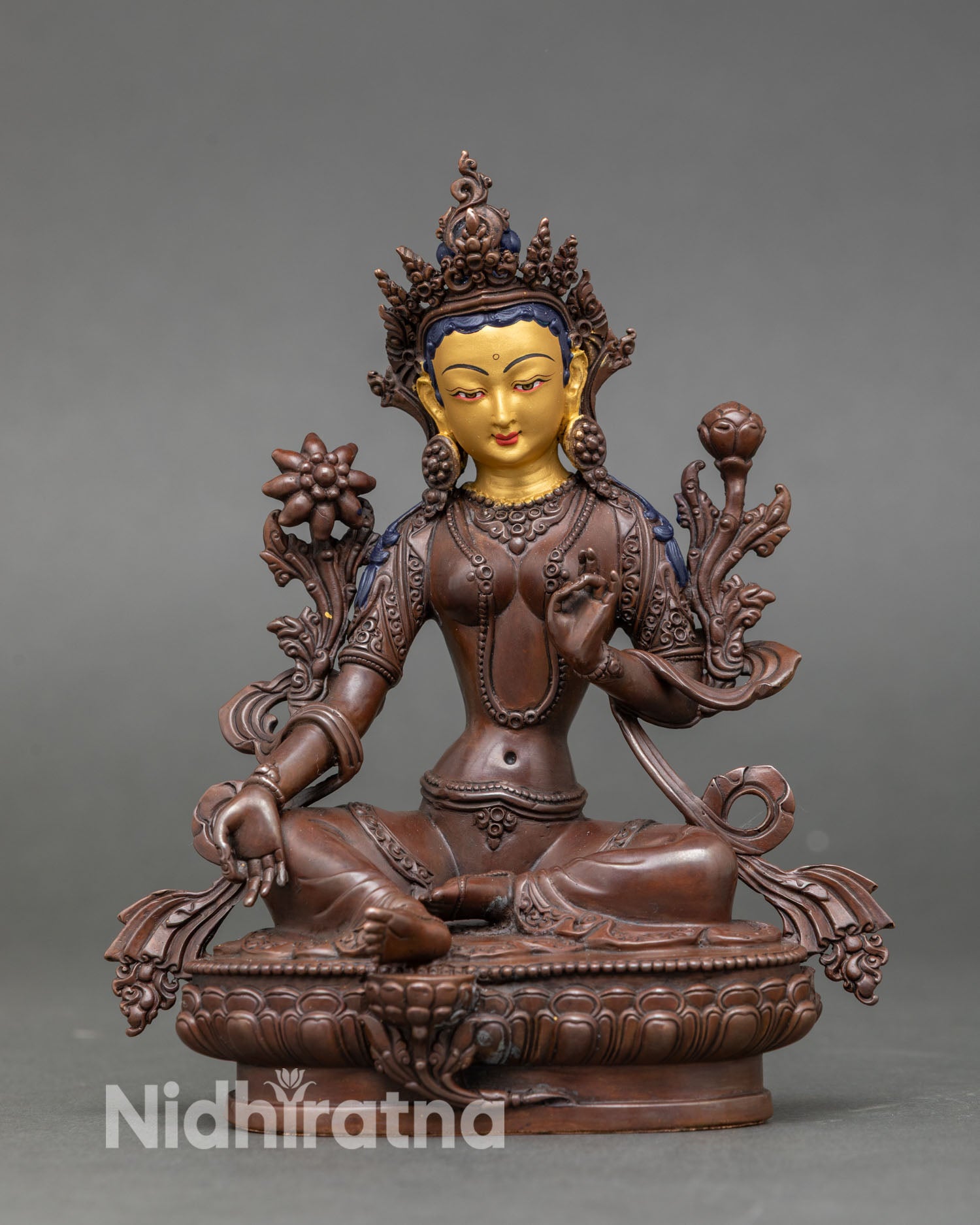 Front view of Green Tara statue, handcrafted by Newari artisan from Patan, Nepal, oxidized copper sacred Buddhist deity with gold painted face