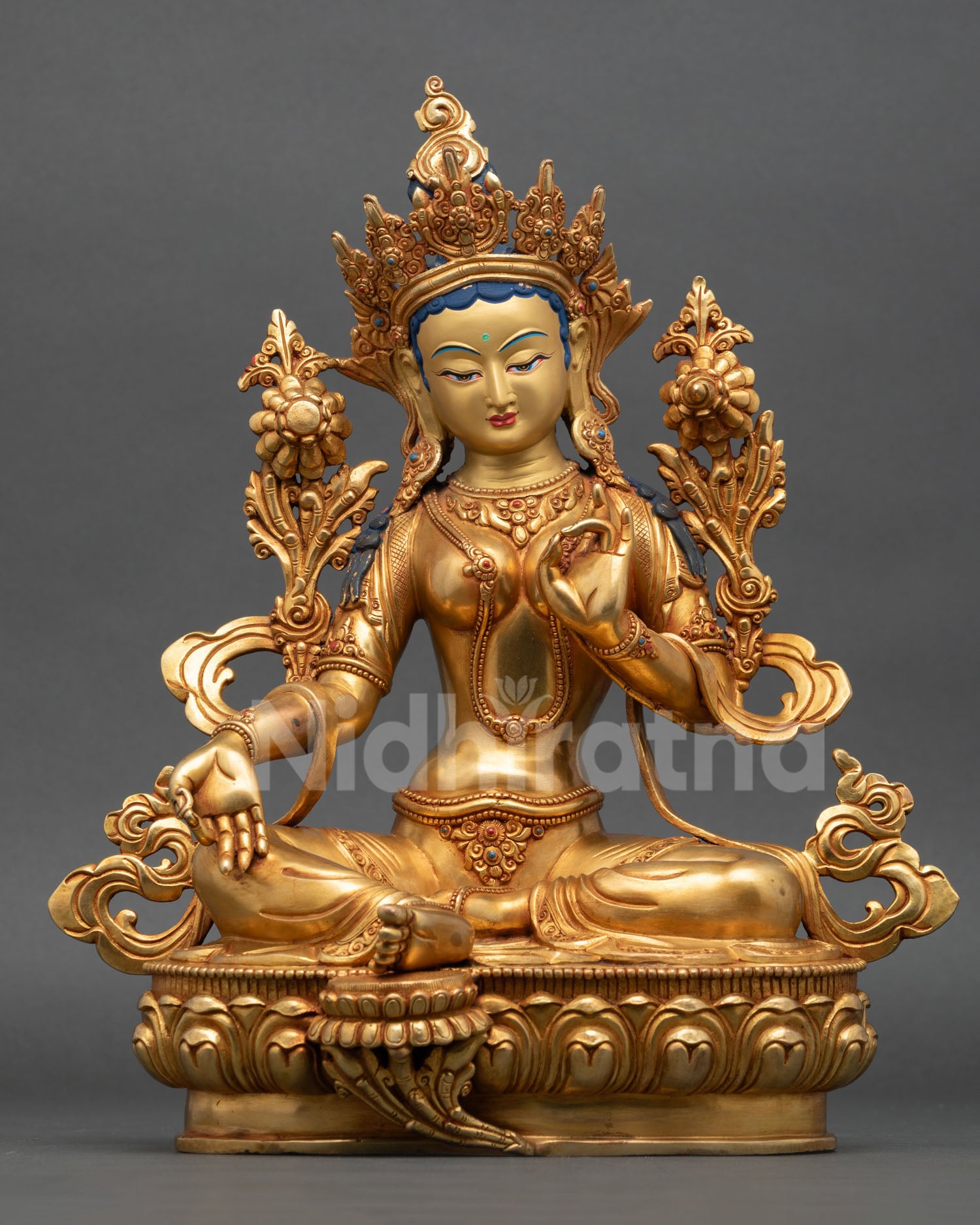Front view of Green Tara statue handcrafted by Newari artisan from Patan Nepal premium copper 24K gold fire gilded gold painted face semi precious stone inlay