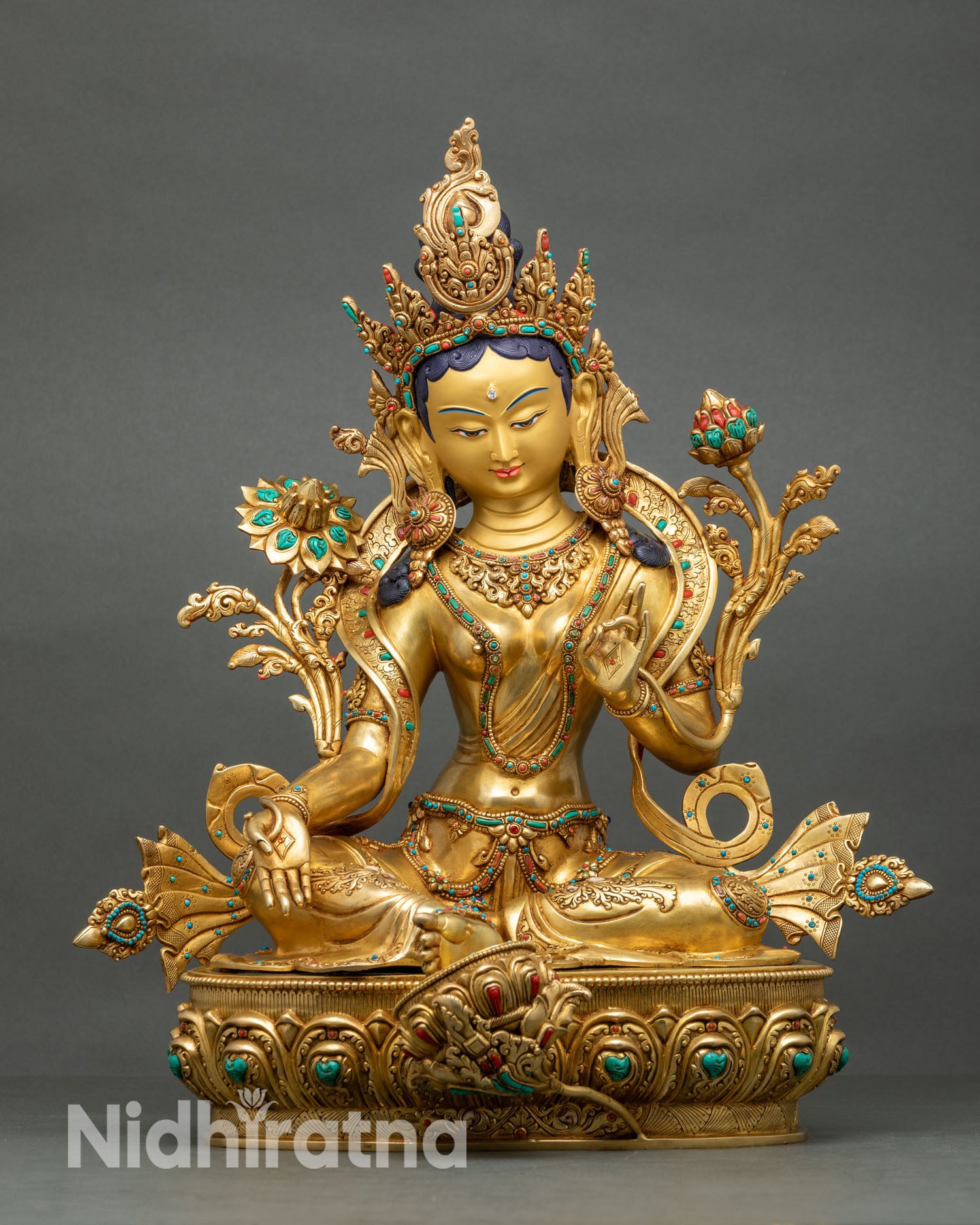 Front view of Green Tara statue handcrafted in Patan, Nepal. 24K gold detailing, lotus pedestal, Buddhist goddess of compassion