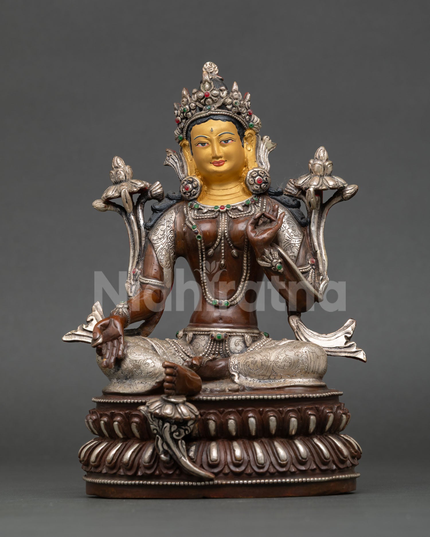 Front view of Green Tara statue oxidized copper silver plated details gold painted face double lotus throne Nepal craftsmanship