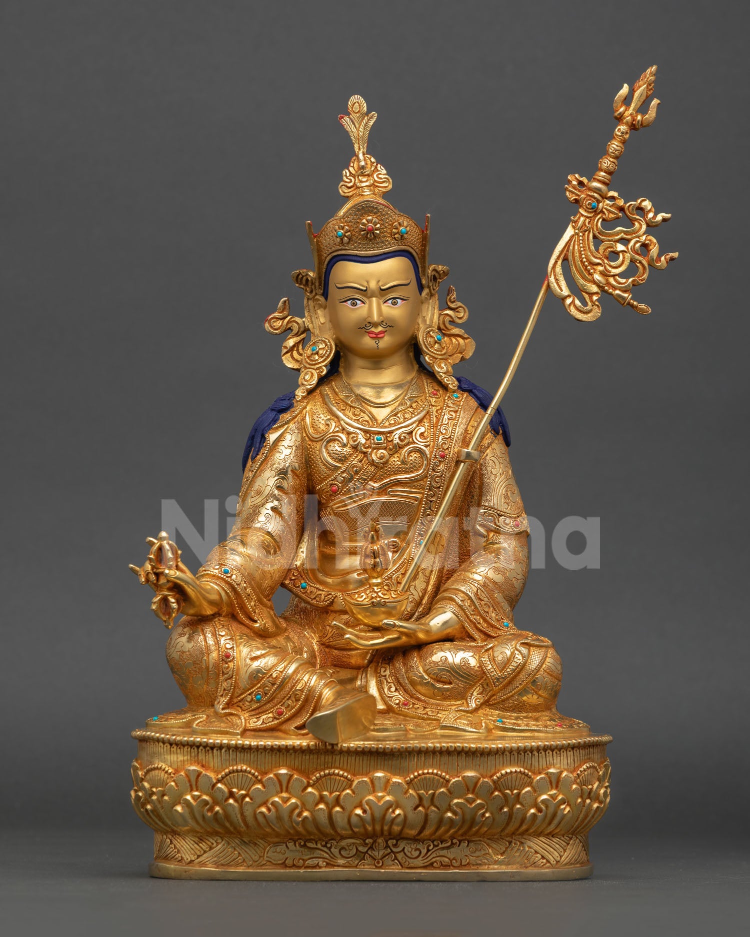 Front view of Guru Rinpoche statue with 24K gold gilding turquoise coral stone inlays and copper craftsmanship Nepal