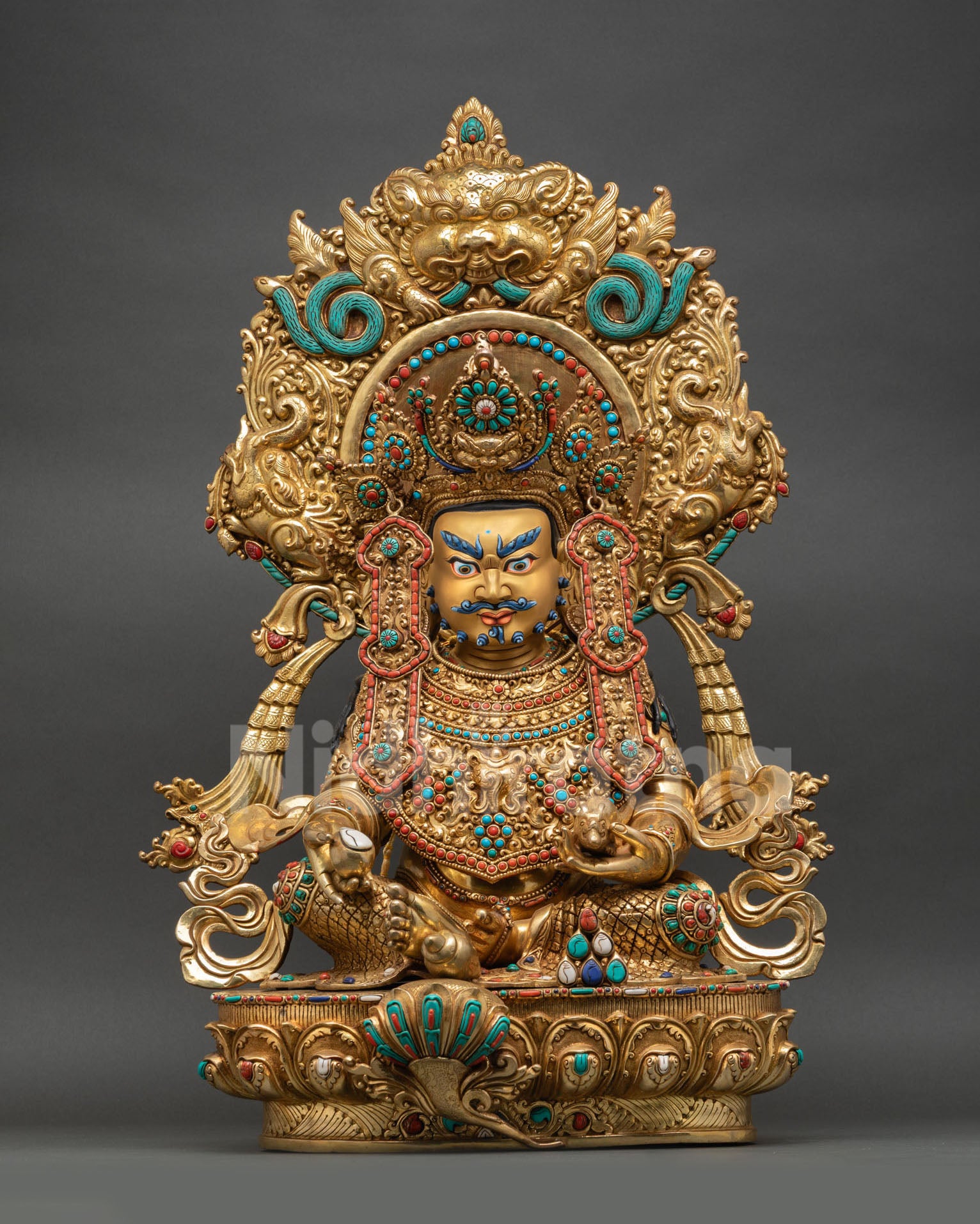 Front view of handcrafted Dzambhala statue copper with 24K gold gilding, jeweled diadem armor, Garuda halo, semi-precious stones, Nepal
