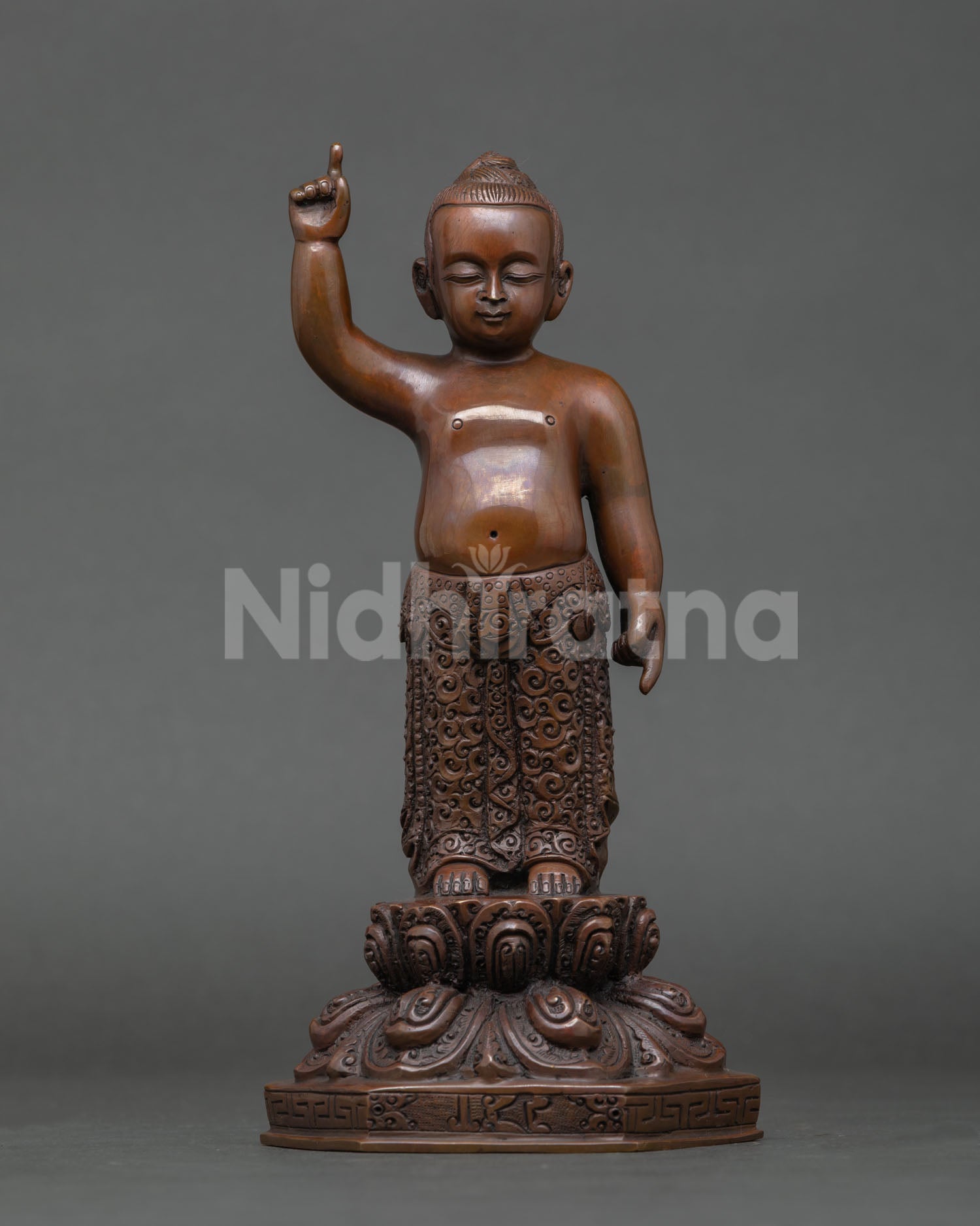 Front view of Little Buddha statue Nepal handcrafted copper sculpture, oxidized finish, lotus throne standing posture meditation altar decor