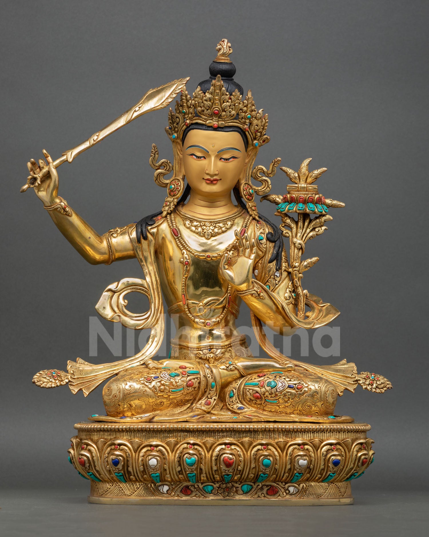 Front view of Manjushree statue with 24K gold gilding and semi precious stones from Nepal