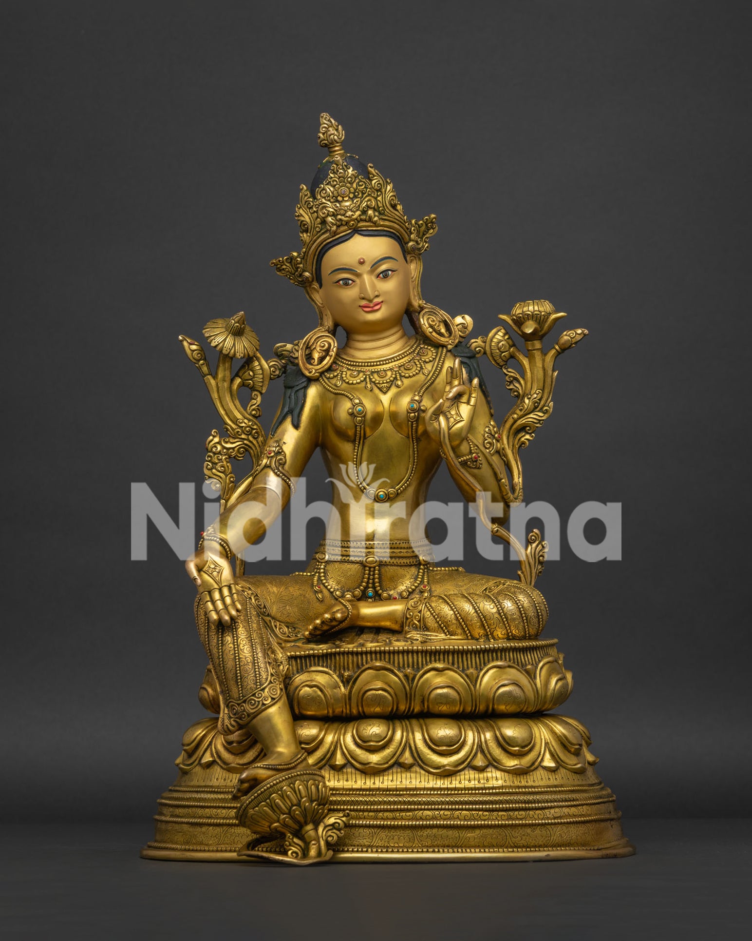 Front view of 24K gold gilded copper Green Tara statue seated on lotus throne.