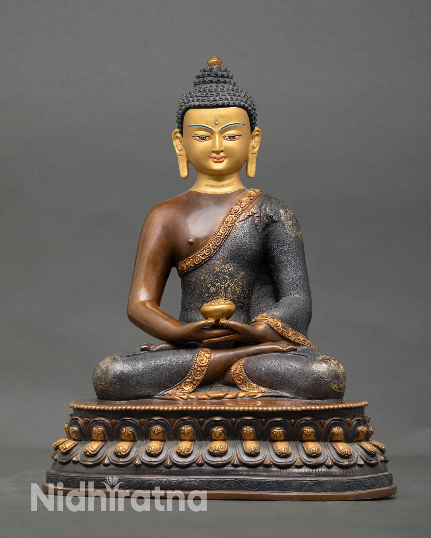 Front view of Amitabha Buddha statue, handcrafted in Nepal with a copper body, oxidized gold gilded finish, gold-painted face, and lotus seat meditation posture