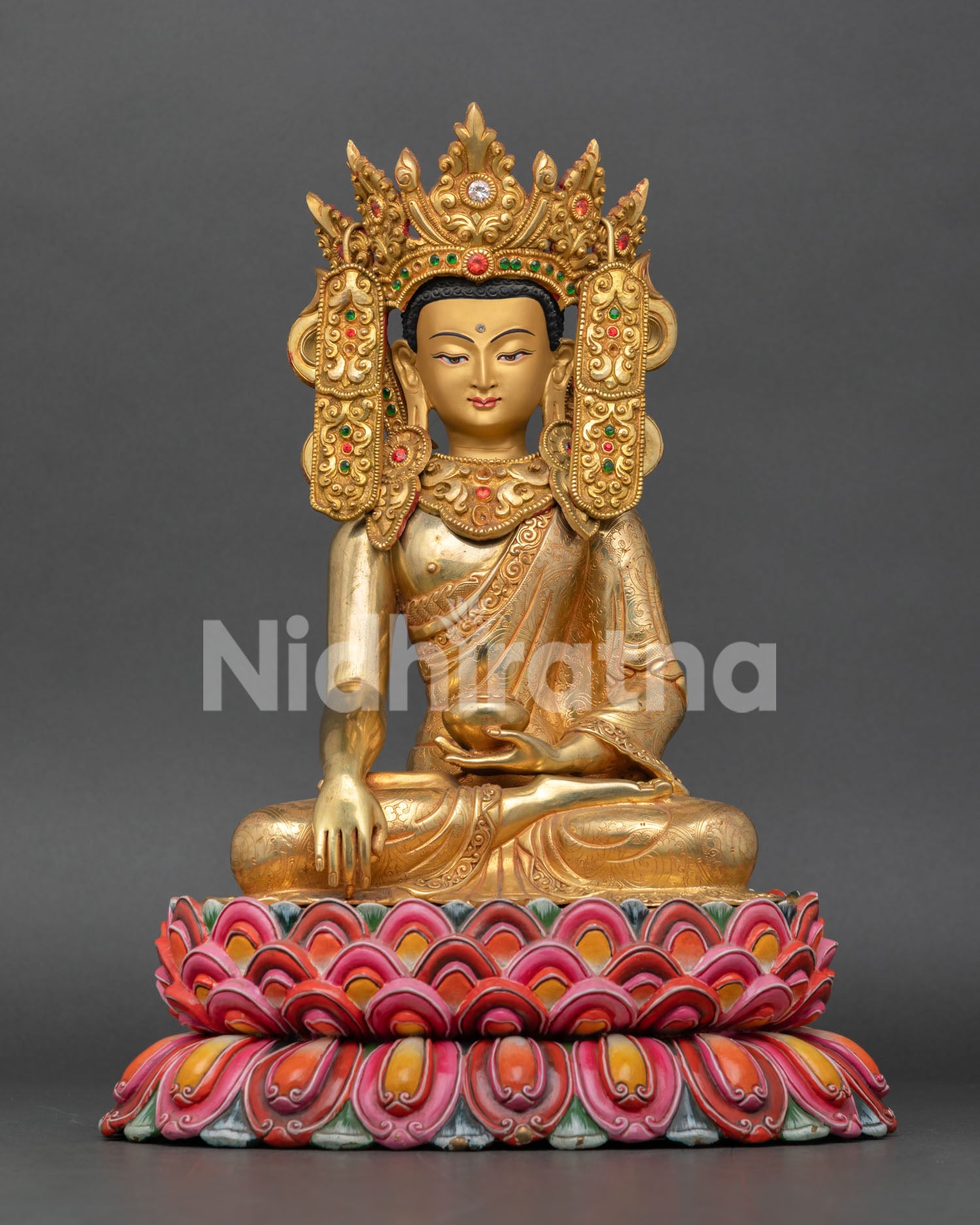 Front view of authentic Jowo Rinpoche Statue, seated on a multi-colored lotus pedestal in Bhumisparsha Mudra, handmade in Patan Nepal.