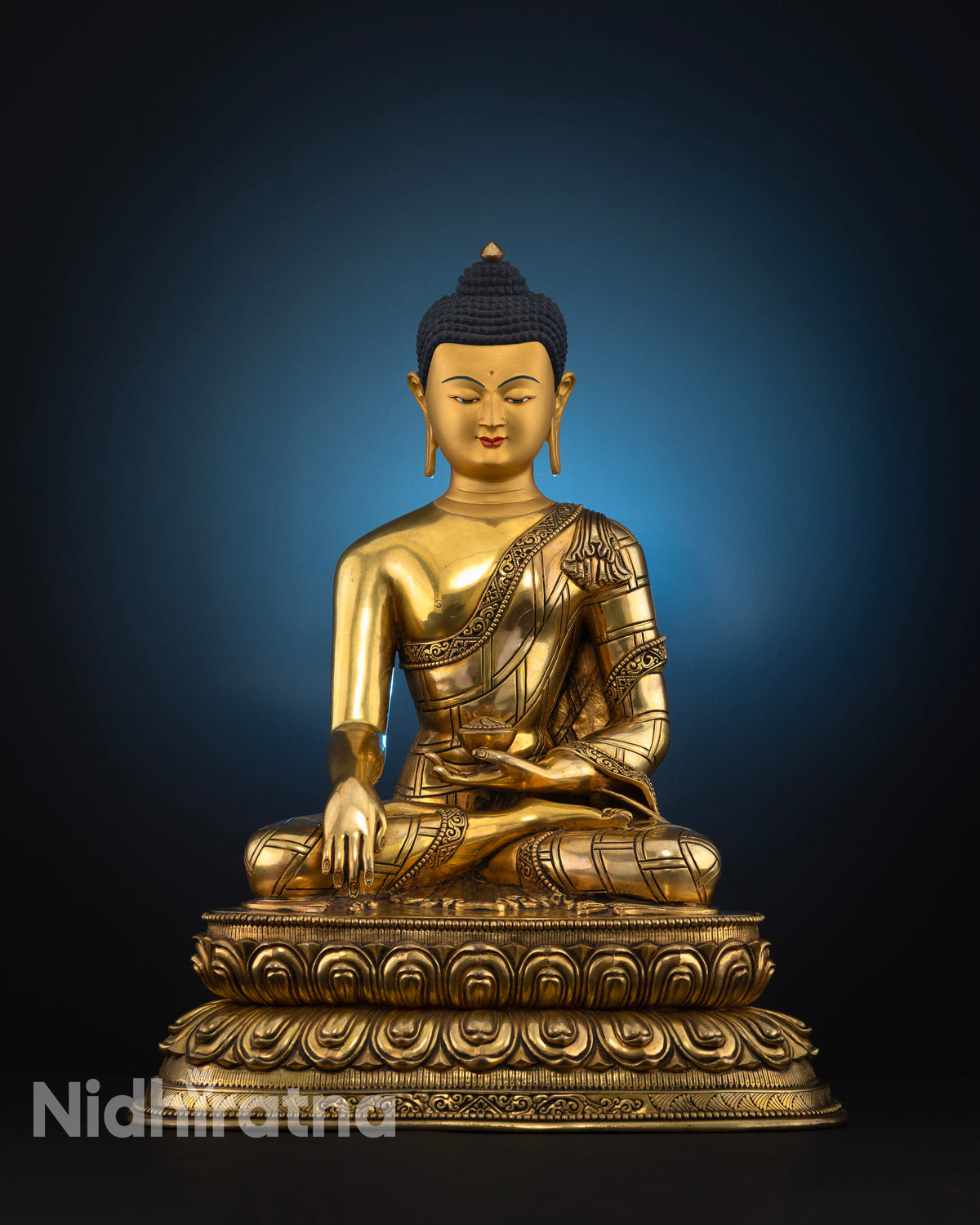 Front view of Buddha Shakyamuni statue with 24K gold fire-gilding, serene gold-painted face, and double lotus pedestal