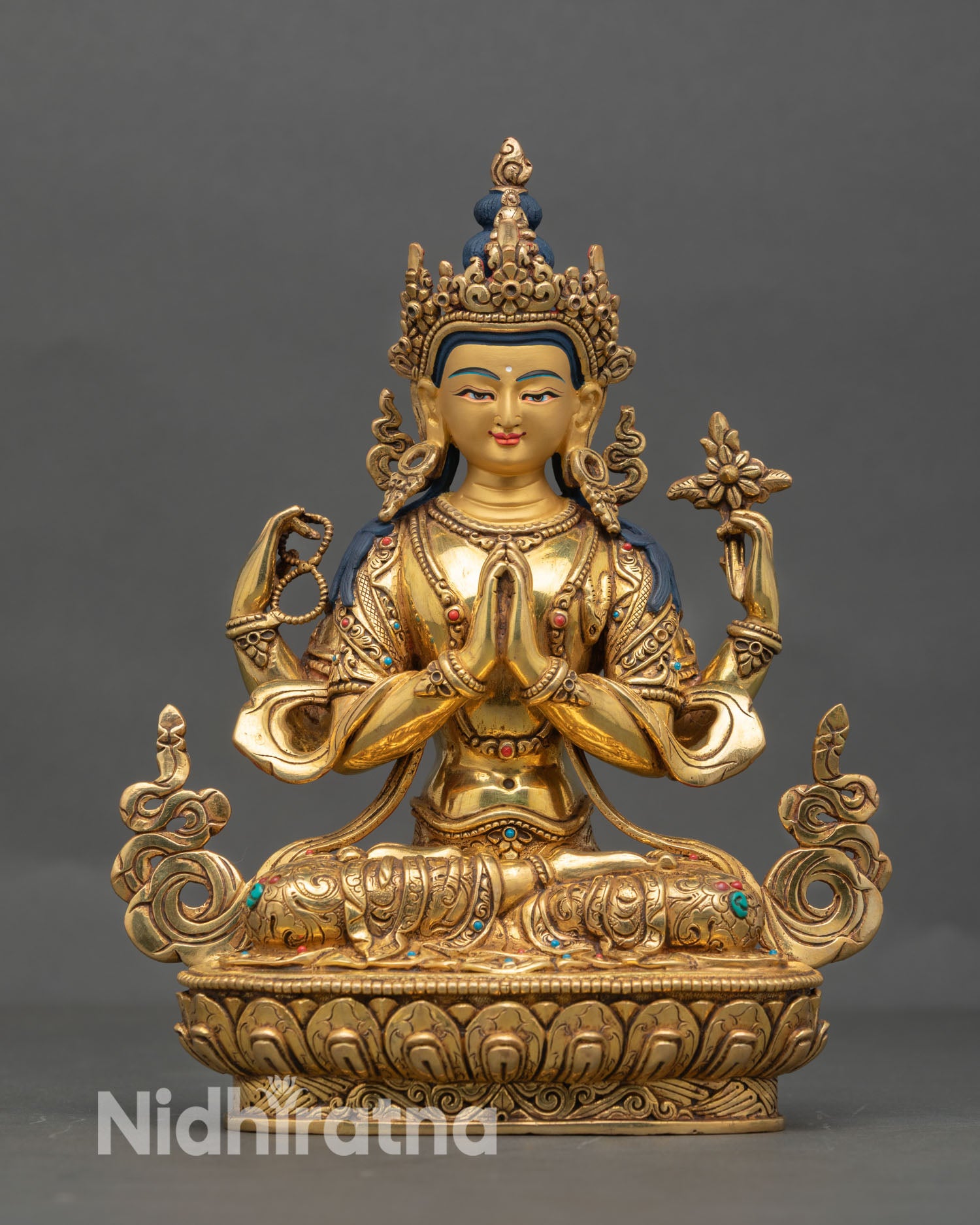 Front view of Chenrezig four armed bodhisattva statue, 24K gold gilded copper, wish fulfilling jewel and serene compassionate face