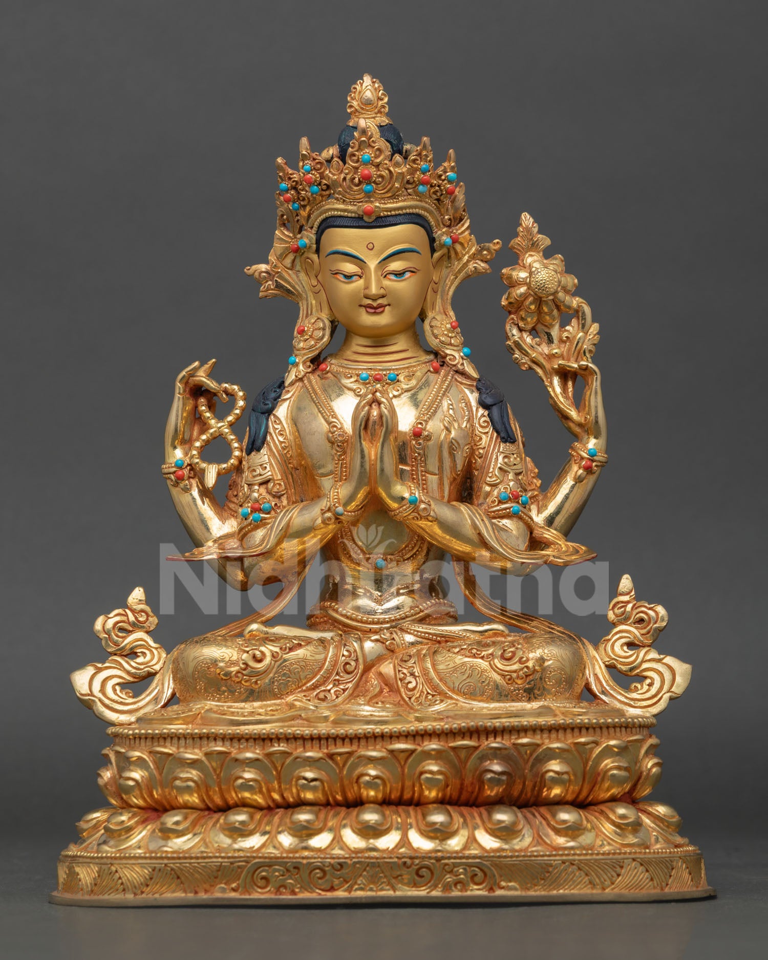 Front view of Chenrezig statue handmade in copper with 24K gold gilding and semi precious stones from Nepal