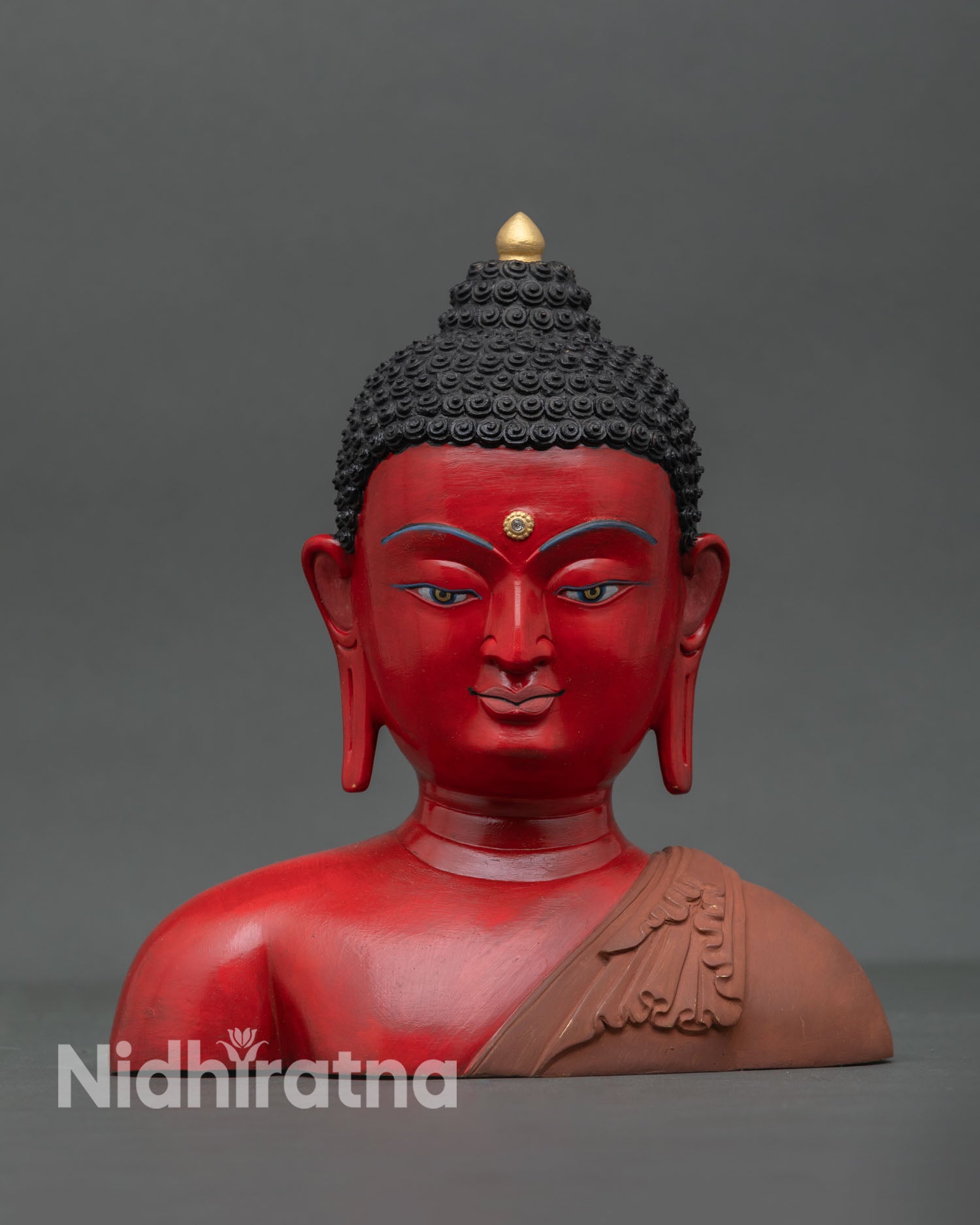 Front view of copper Buddha sculpture with hand painted acrylic colors crafted by Newari artisans from Patan Nepal for home decor and meditation space