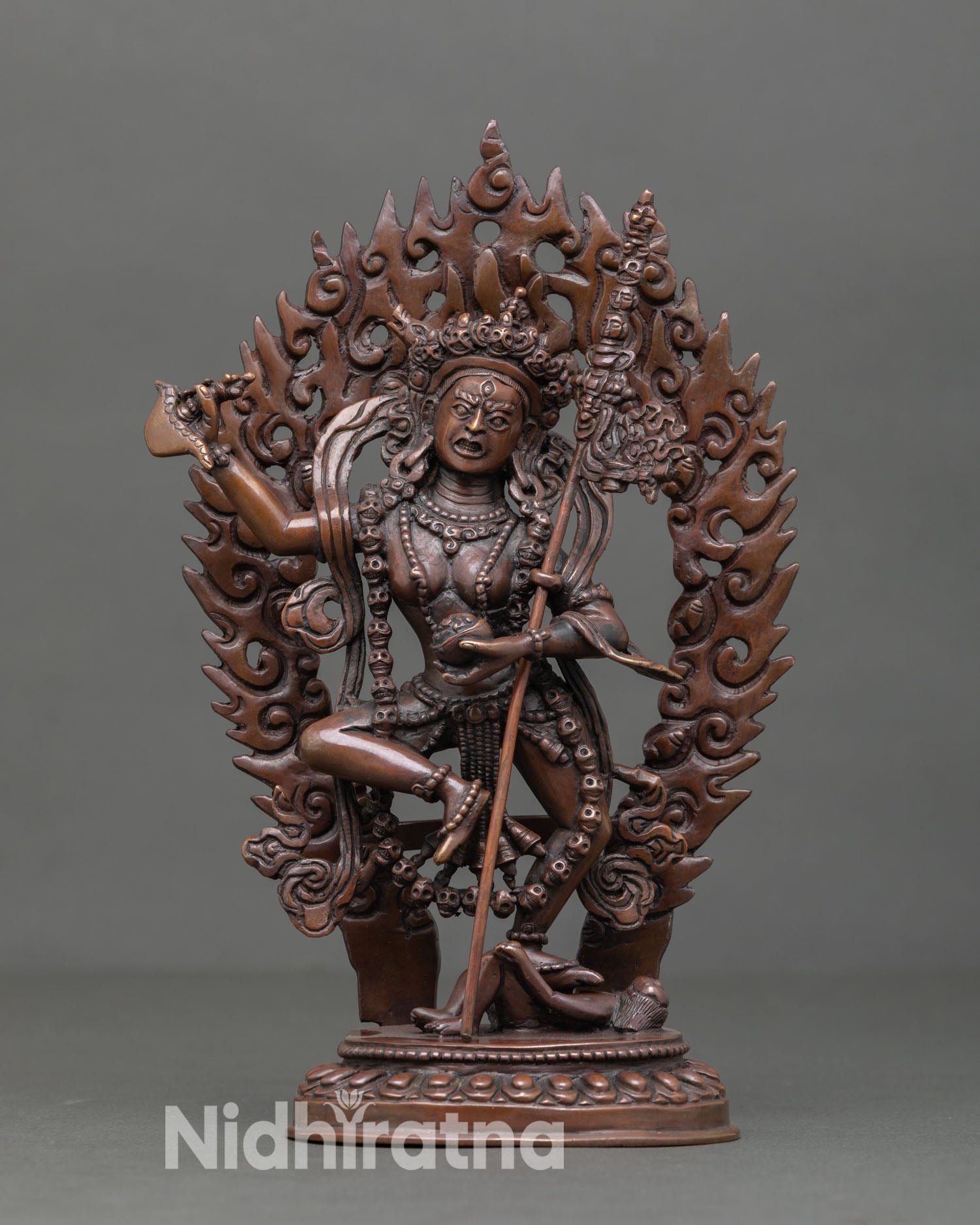 Front view of Dorje Phagmo statue in oxidized copper, handmade in Nepal Tibetan dakini sculpture created using lost wax casting for Buddhist altar decor.