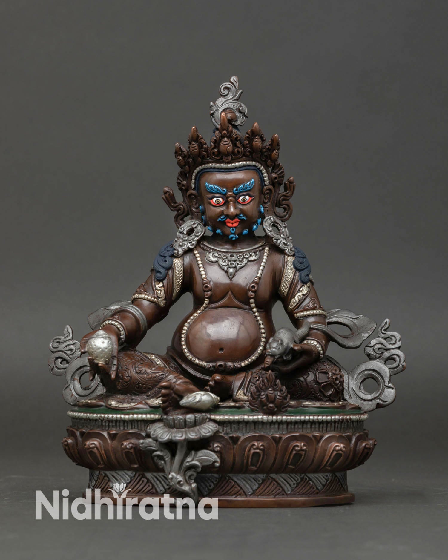 Front view of Dzambhala statue handcrafted in Nepal in premium copper with oxidized finish, detailed Himalayan craftsmanship for Buddhist altar decor