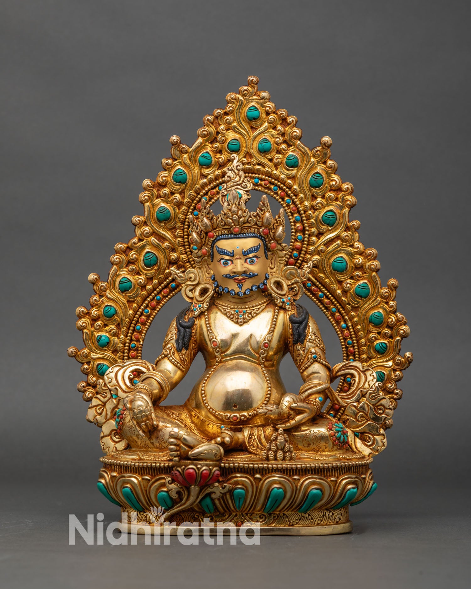 Front view of Dzambhala wealth deity statue, gold-gilded Buddhist sculpture from Nepal