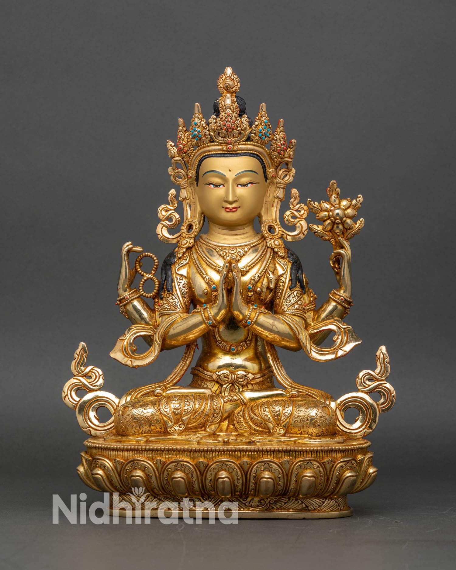 Front view of four-armed Chenrezig statue from Nepal with 24K gold gilded copper finish