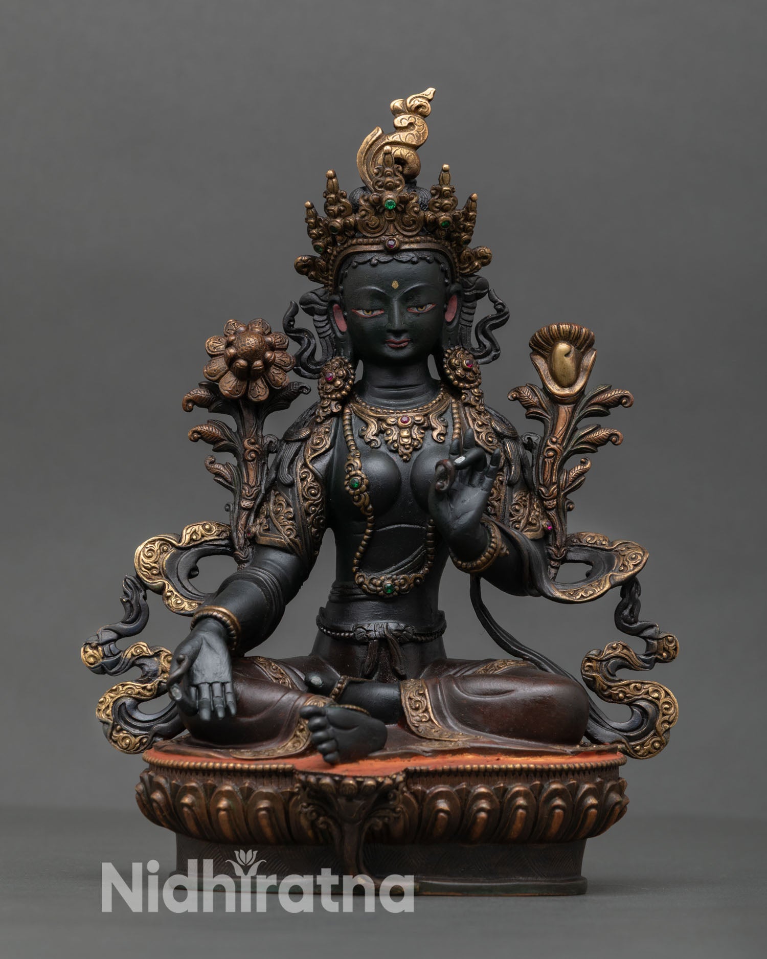 Front view of Green Tara statue handcrafted in Nepal from solid copper with hand painted acrylic colors and ornate lotus seat.
