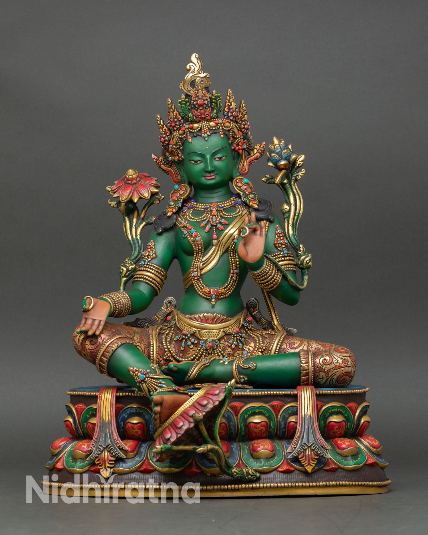 Front view of Green Tara statue handcrafted in Nepal with gold gilding and hand-painted details
