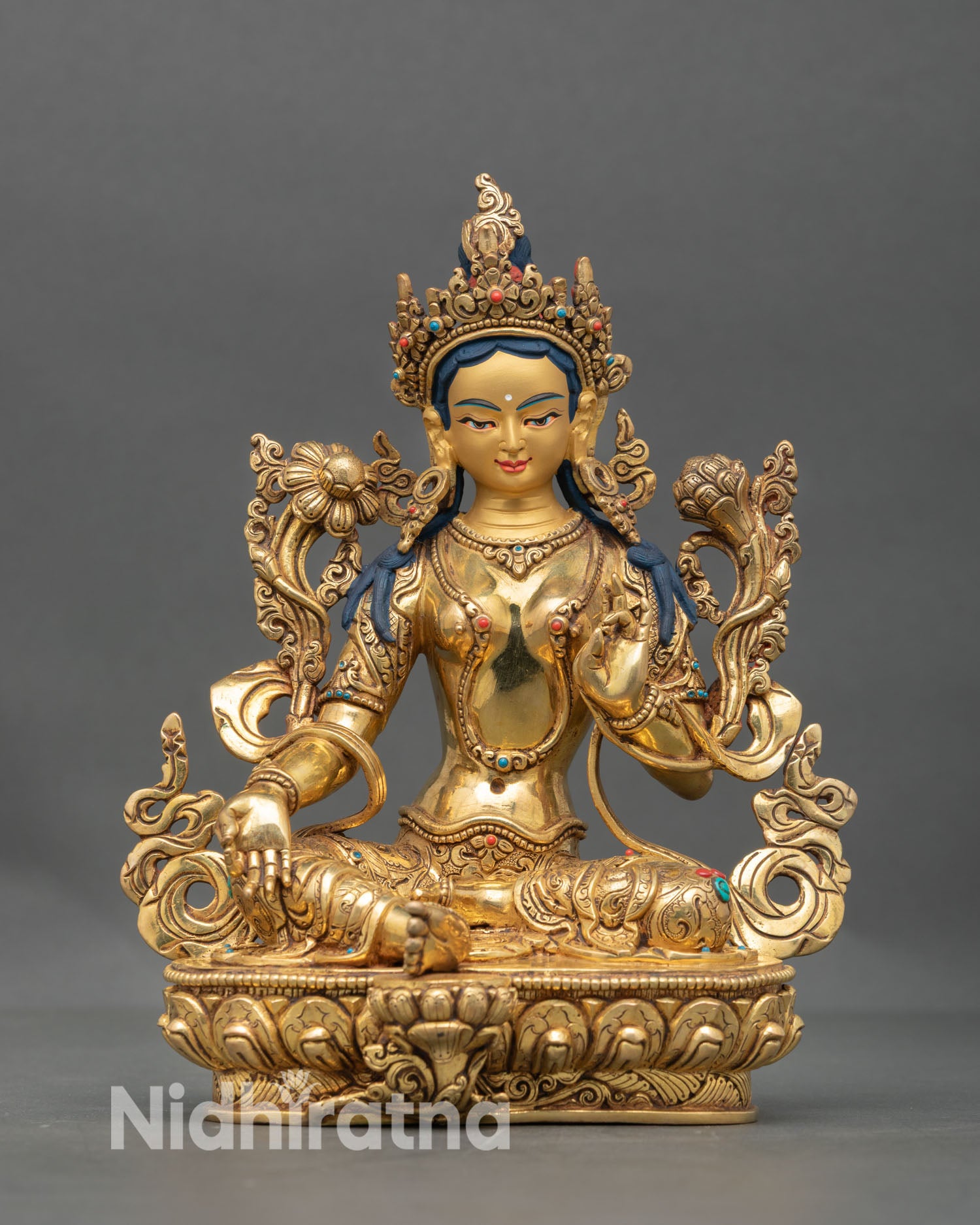 Front view of Green Tara statue handmade in Nepal with gold fire gilded copper, lotus seat, and serene expression for spiritual home decor
