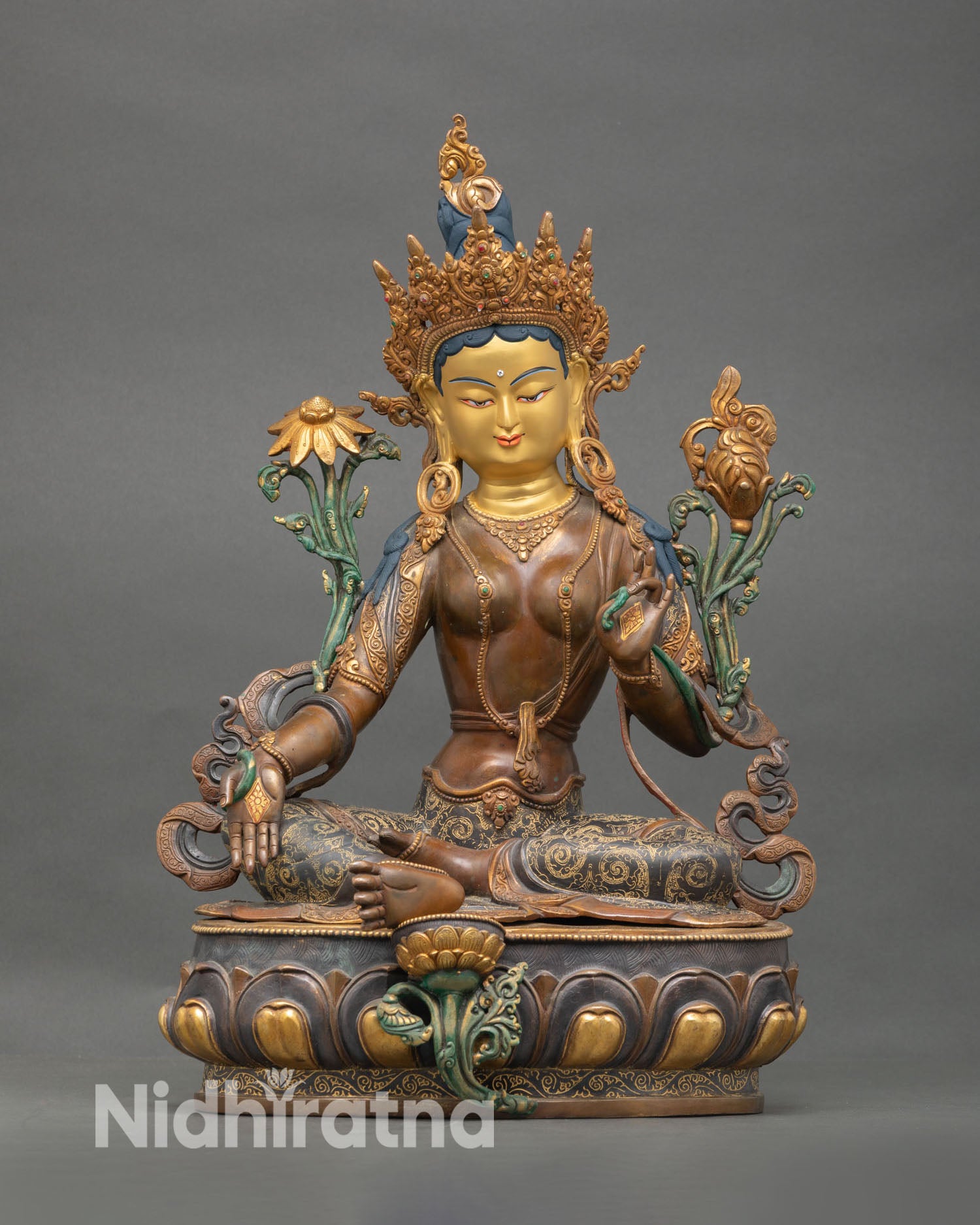 Front view of Green Tara statue handmade Nepal copper oxidized finish gold gilded details gold painted face Buddhist goddess sculpture
