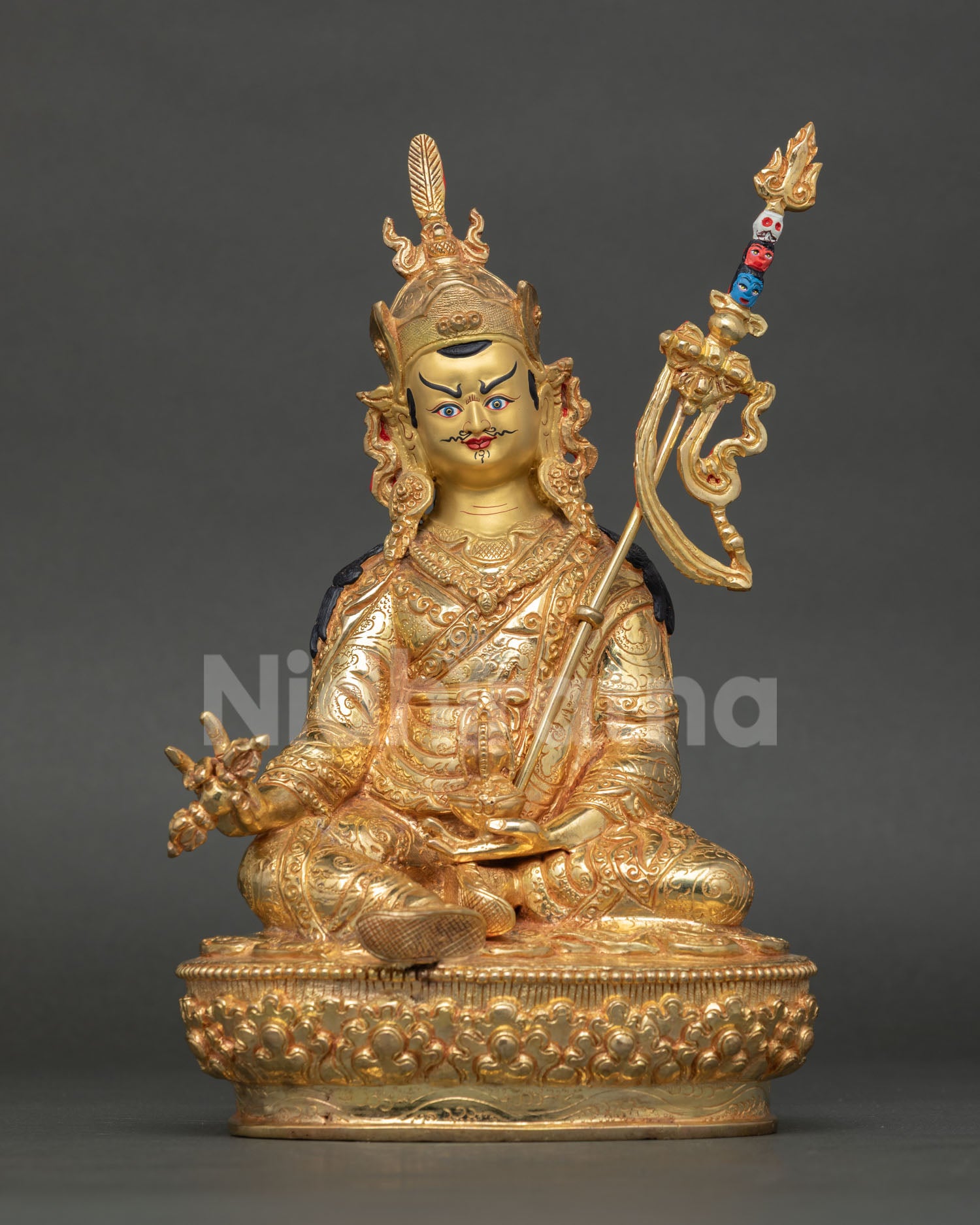 Front view of Guru Rinpoche statue, handcrafted in copper with 24K gold fire-gilded finish and detailed Himalayan Buddhist artistry.
