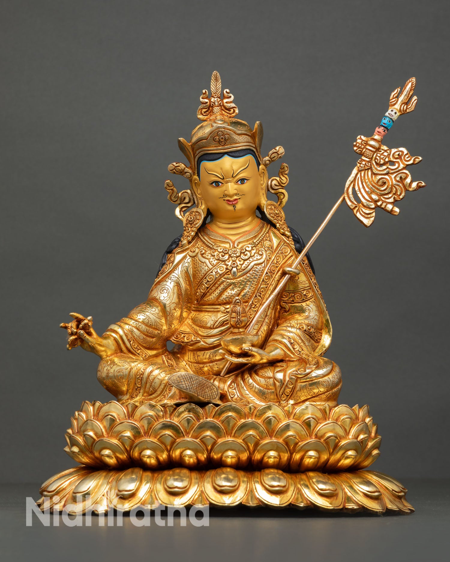 Front view of Guru Rinpoche statue handcrafted Nepal pure copper sculpture with gold gilding and gold painted face for altar decor