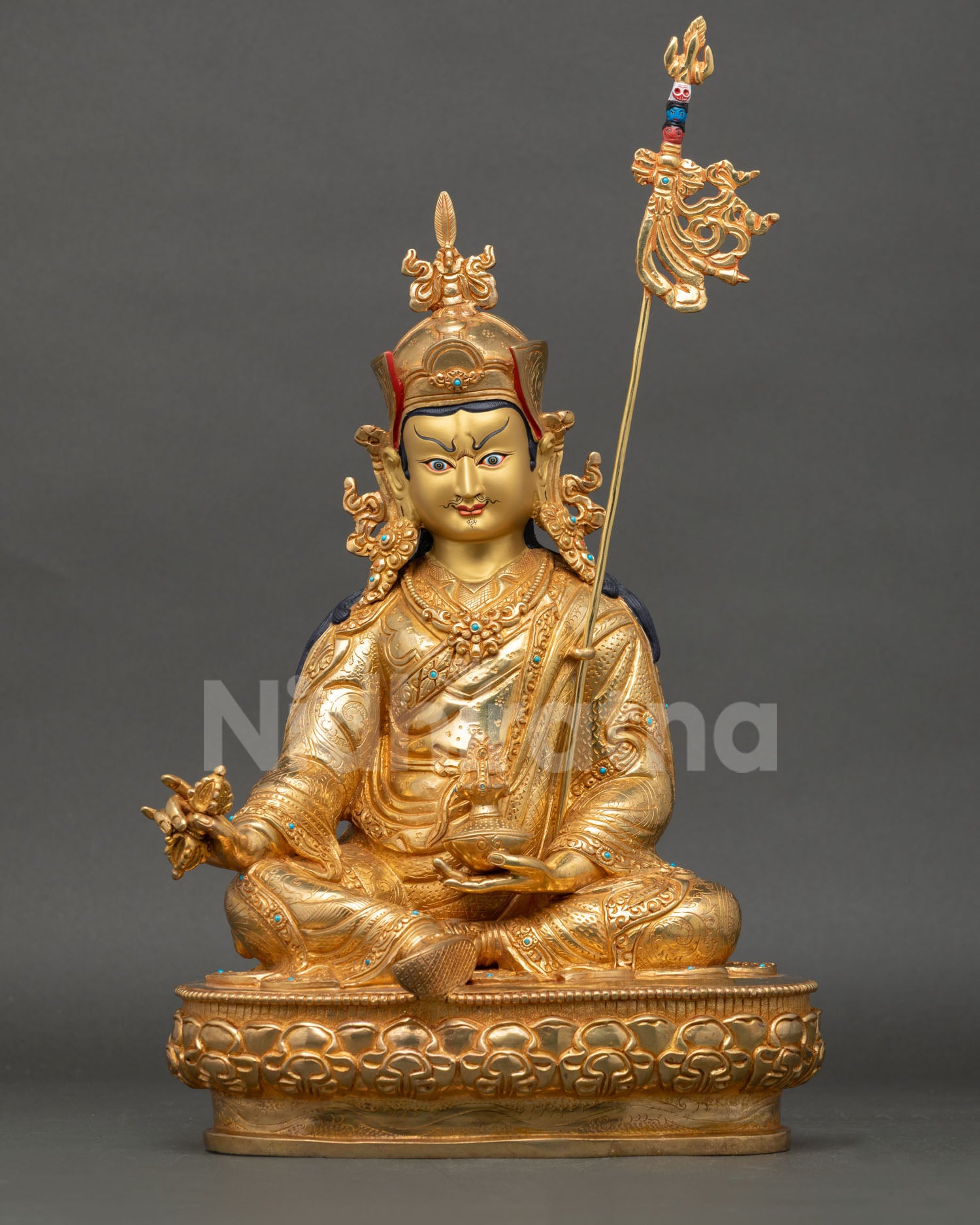 Front view of Guru Rinpoche statue Padmasambhava handmade in copper with gold gilding and gold painted face from Nepal